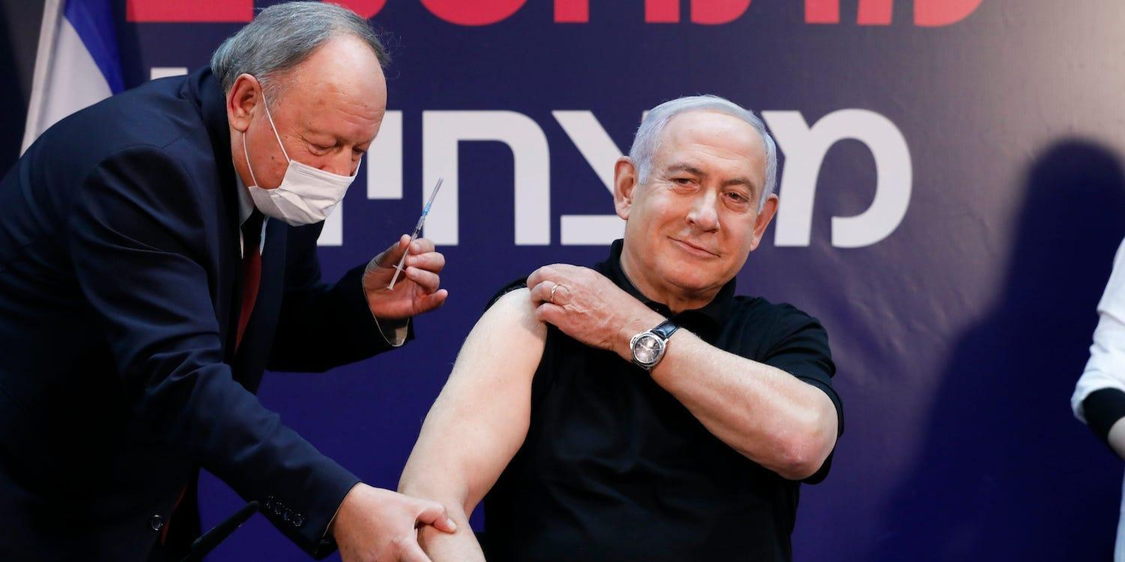 Israeli Prime Minister Minister Benjamin Netanyahu receives a coronavirus vaccine at Sheba Medical Center in Ramat Gan, Israel on Saturday, Dec. 19, 2020.