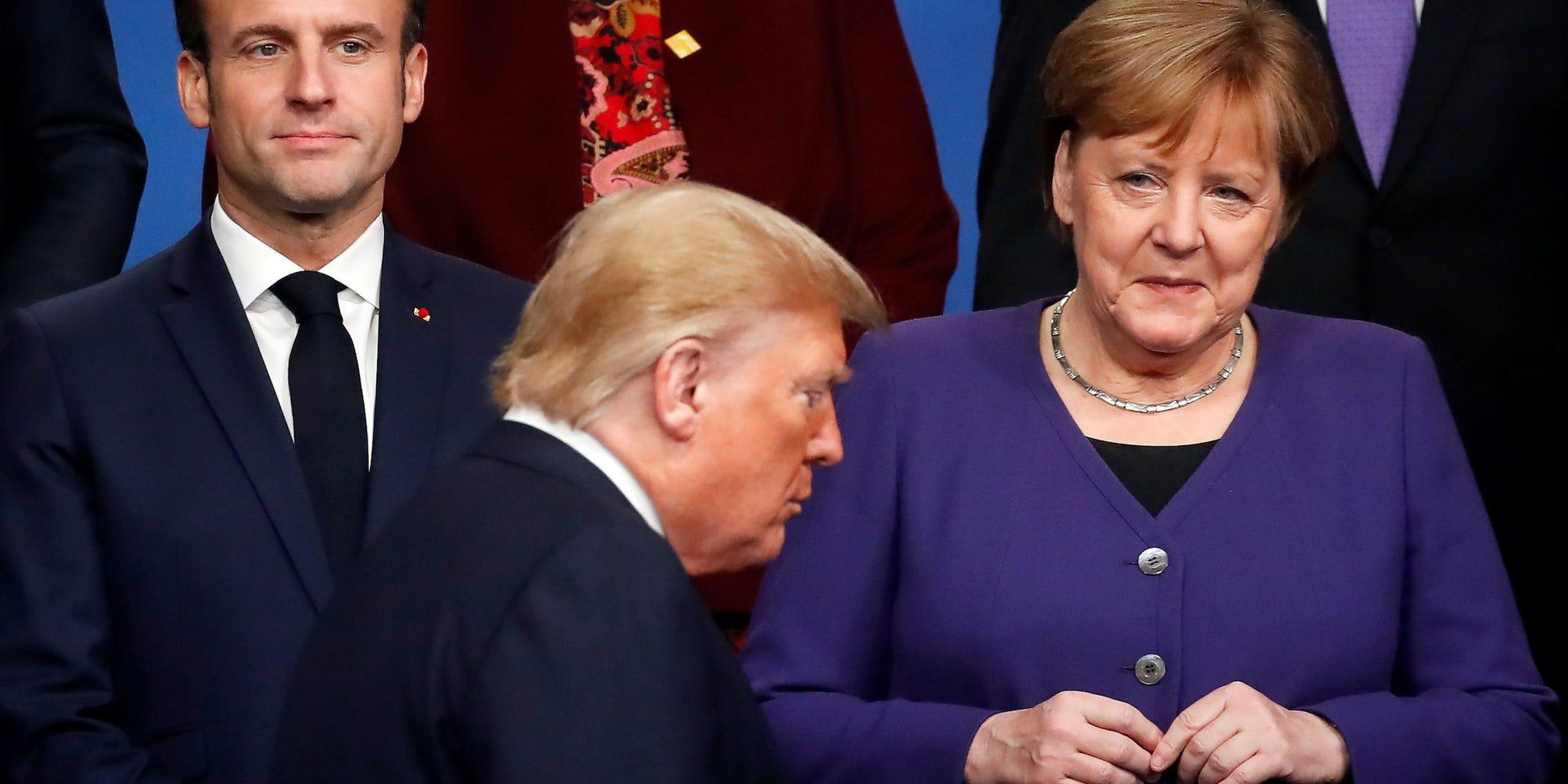 Emmanuel Macron, Donald Trump y Angela Merkel durante una cumbre internacional.
