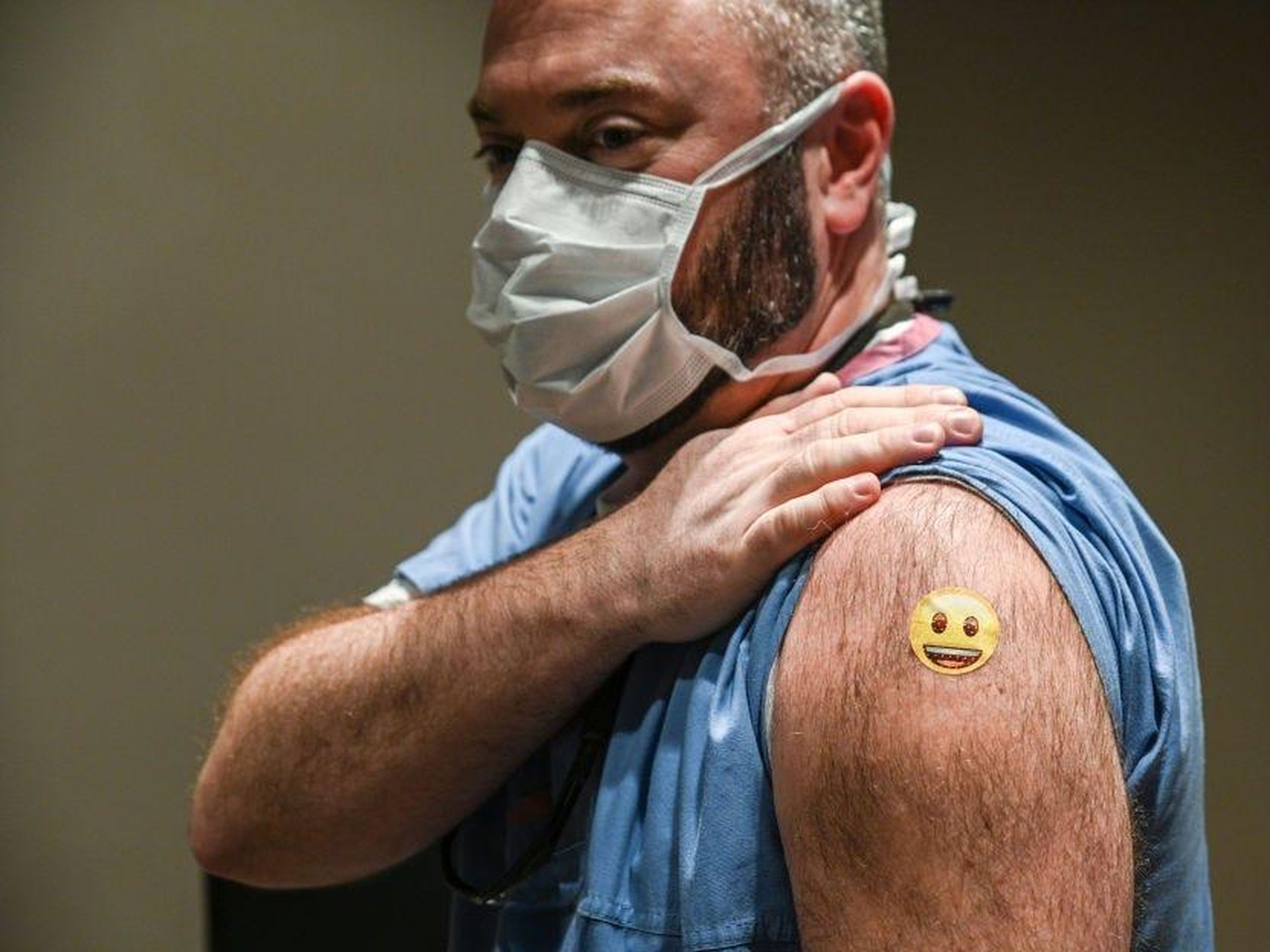 Dr. Jason Smith showed off his bandage after getting vaccinated at the University of Louisville Hospital in Kentucky.