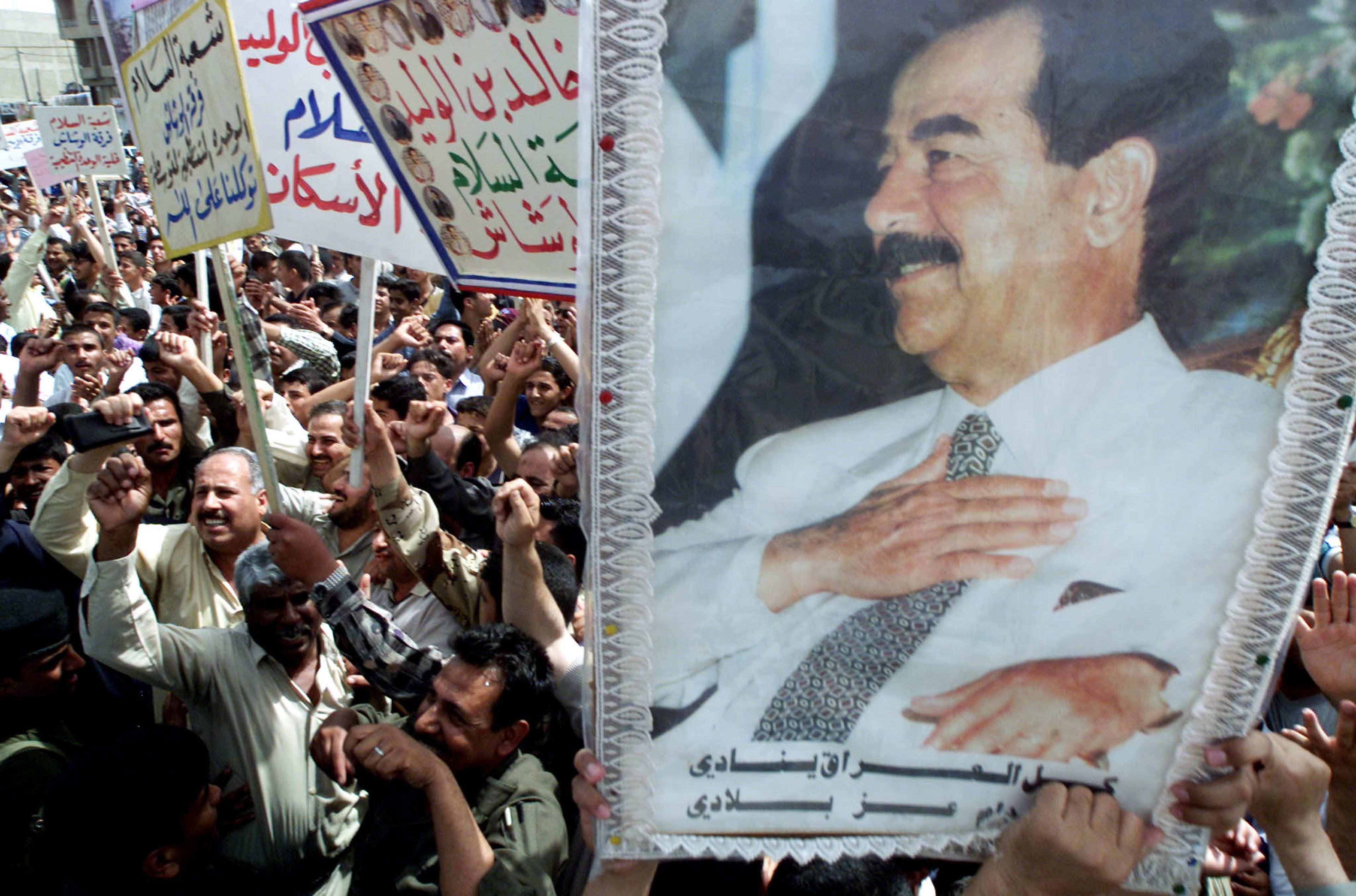 Retrato de Saddam Hussein, durante una manifestación en Bagdad (Irak).