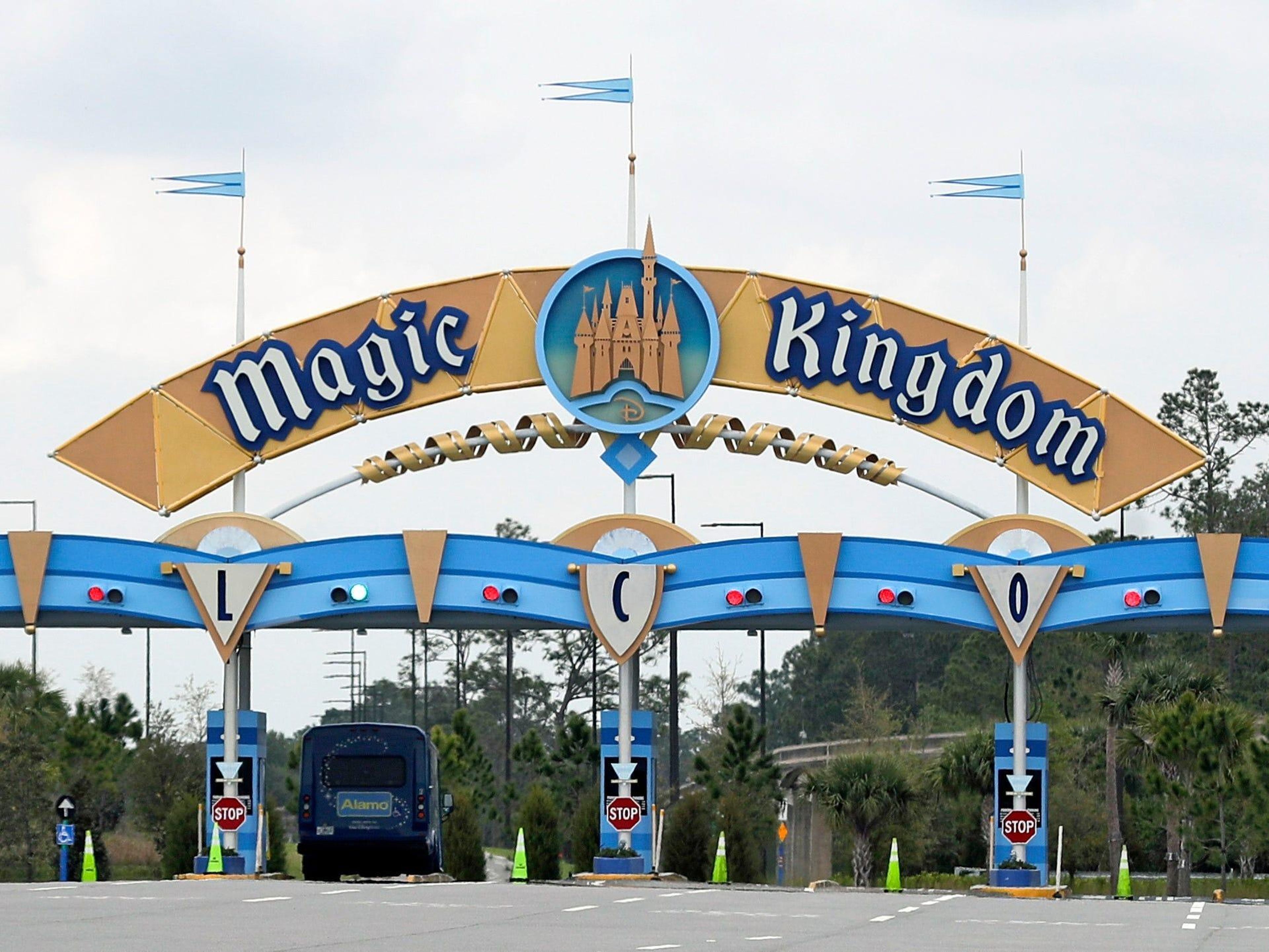 FILE - In this March 16, 2020, file photo, the entrance to the parking lot at the Magic Kingdom at Walt Disney World is closed in Lake Buena Vista, Fla. The Splash Mountain ride at Disney parks in California and Florida is being recast. Disney officials