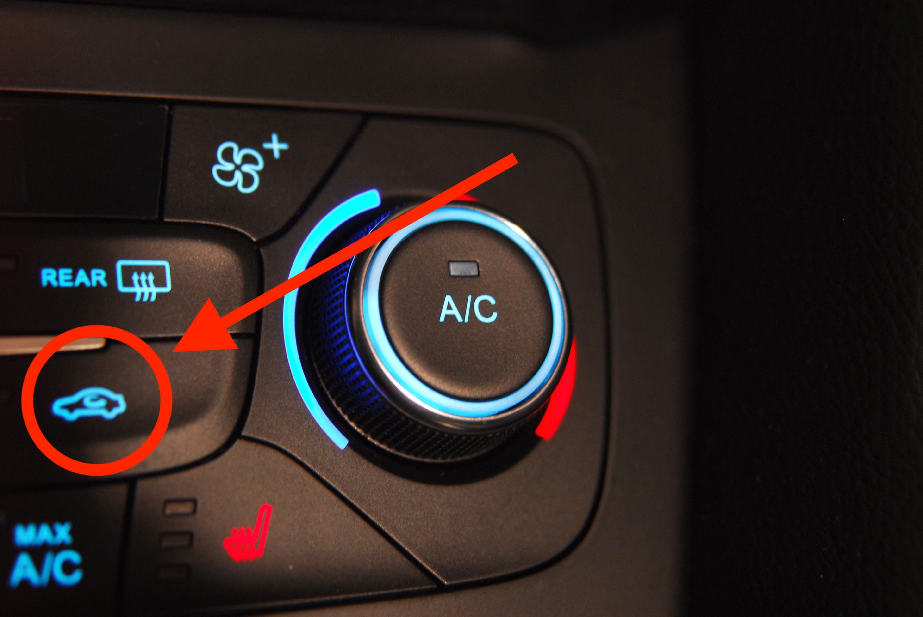 Botón de recirculación del aire del coche