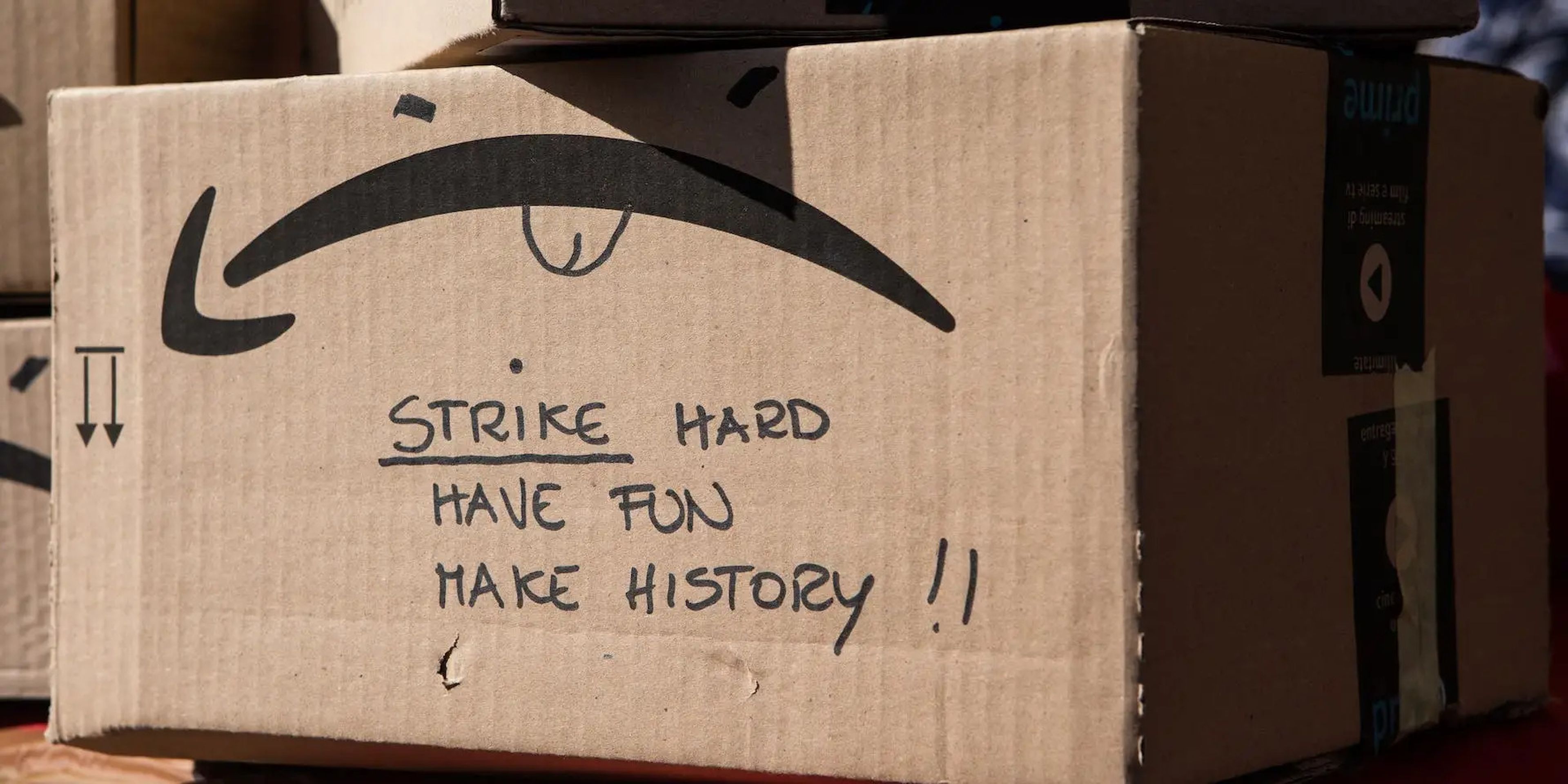 An Amazon box that reads "Strike hard, have fun, make history!"