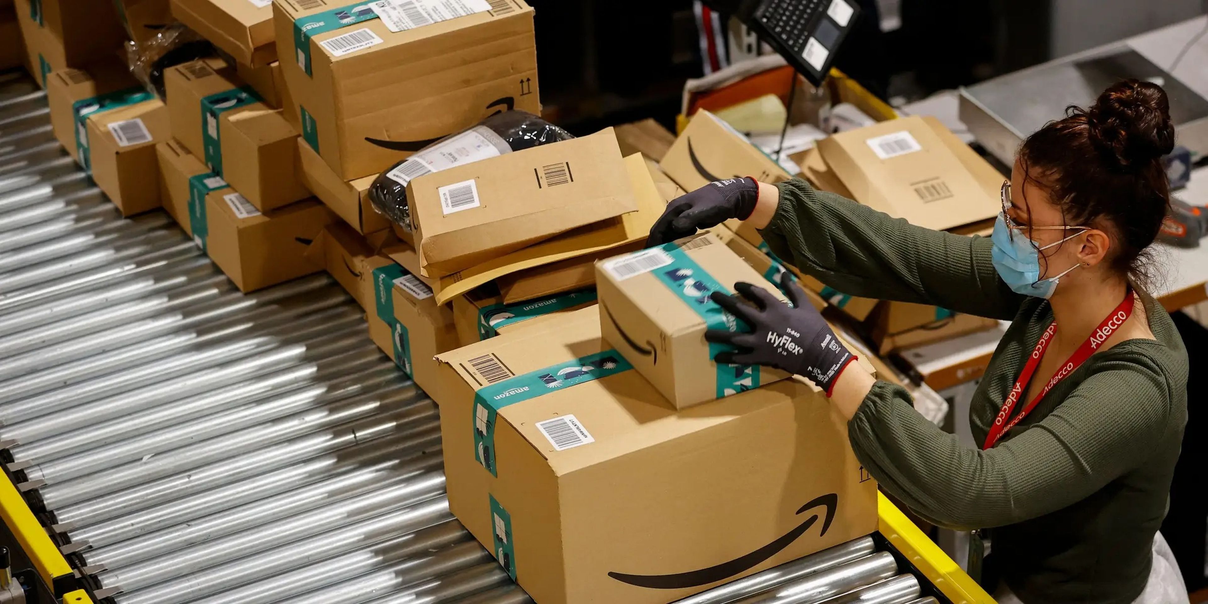 An employee handles packages at the Amazon's Bretigny-sur-Orge warehouse in France.