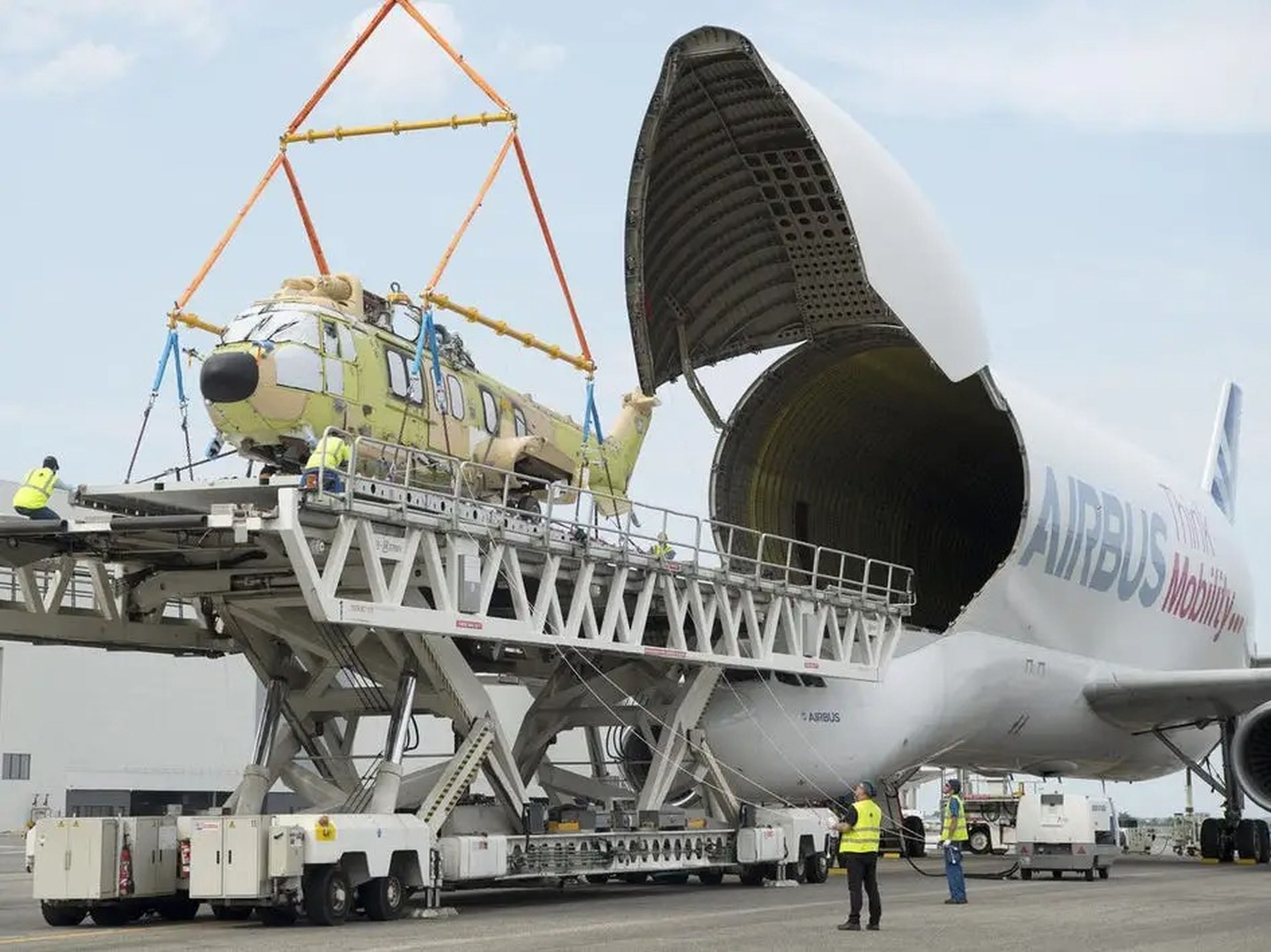 Airbus BelugaST loading helicopter.
