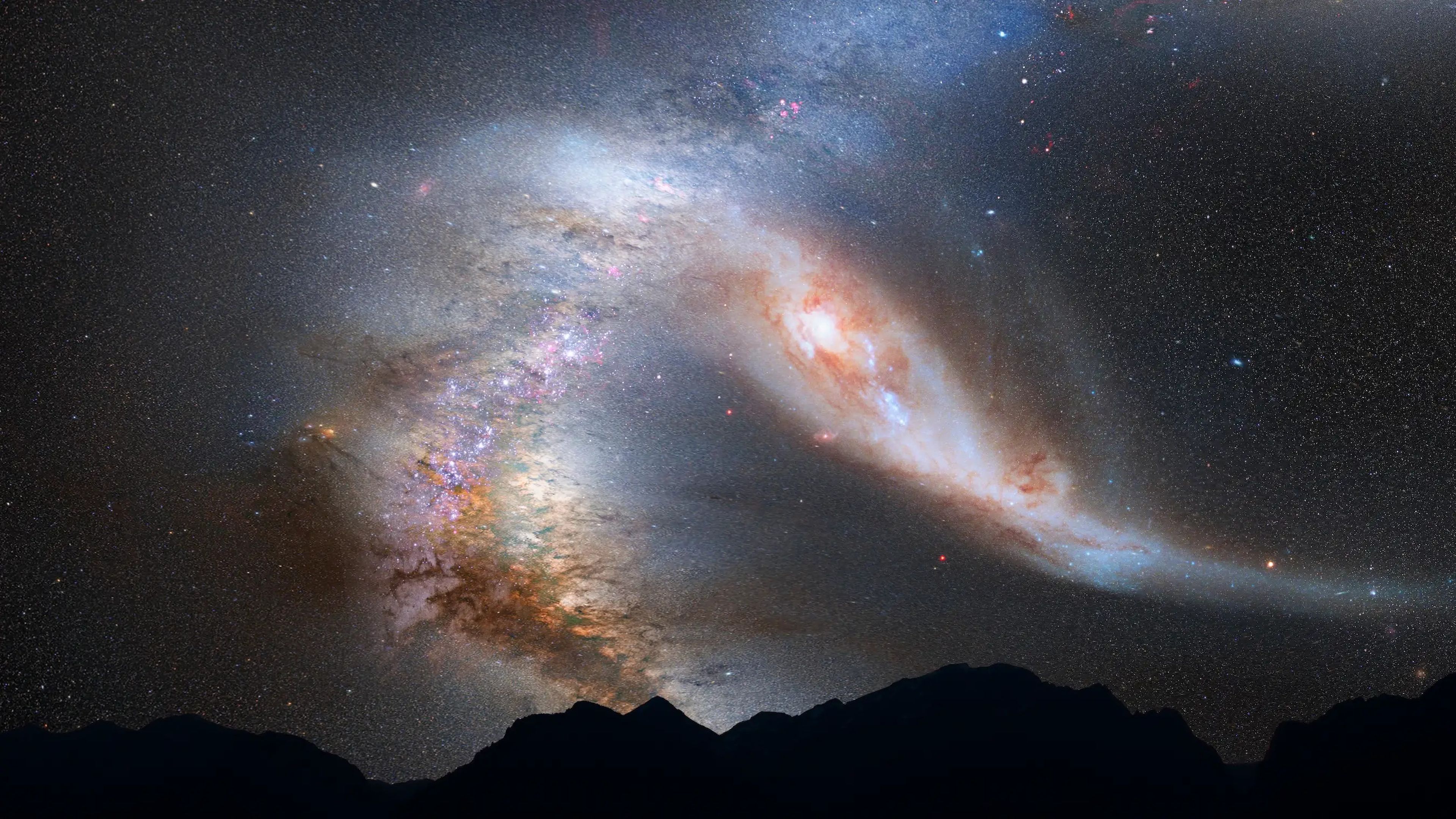 Una ilustración muestra la galaxia de Andrómeda interactuando con la Vía Láctea, tal como se vería desde la Tierra dentro de unos 3.750 millones de años.