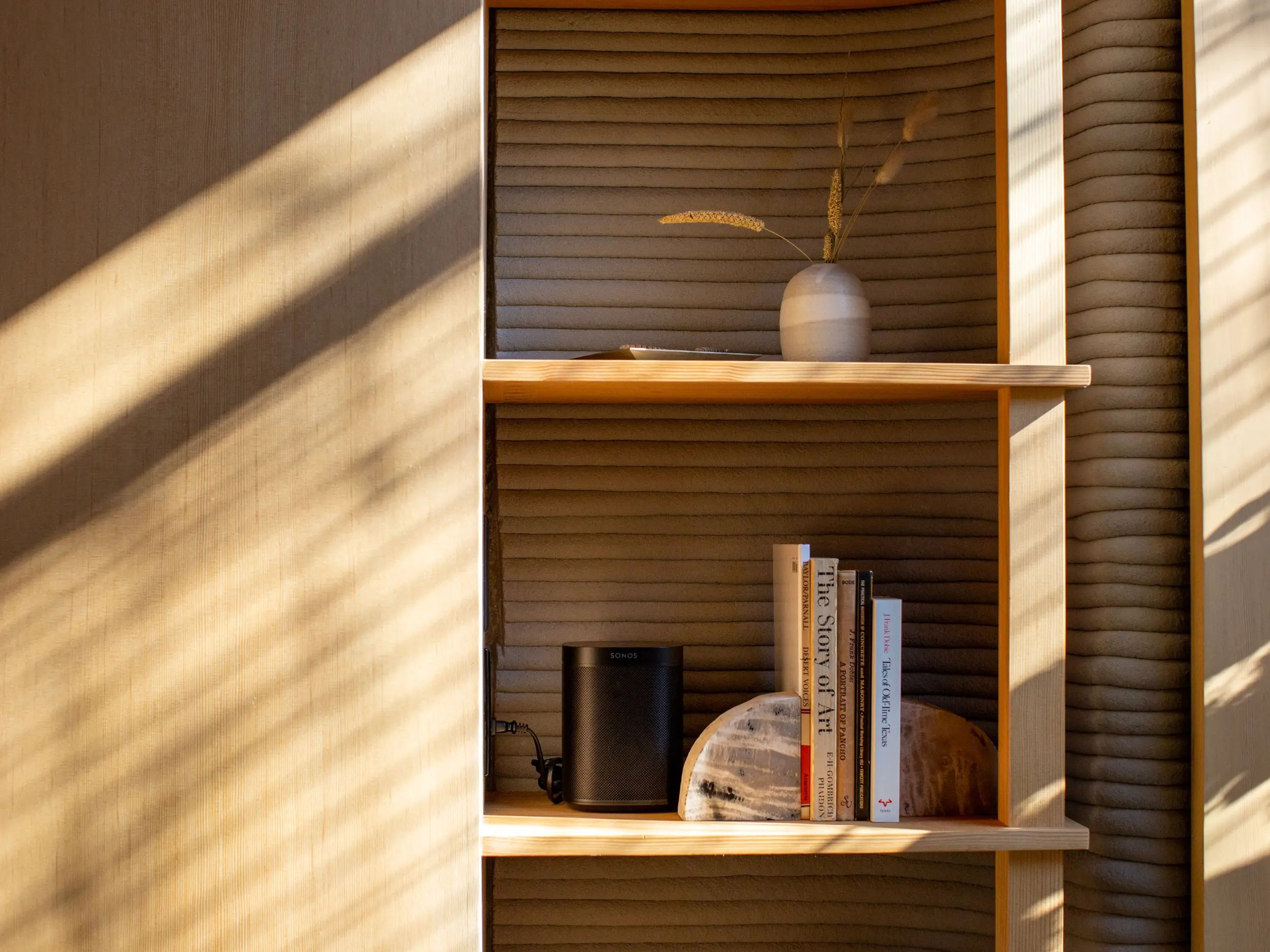 Light and shadows shining on a shelving storage.