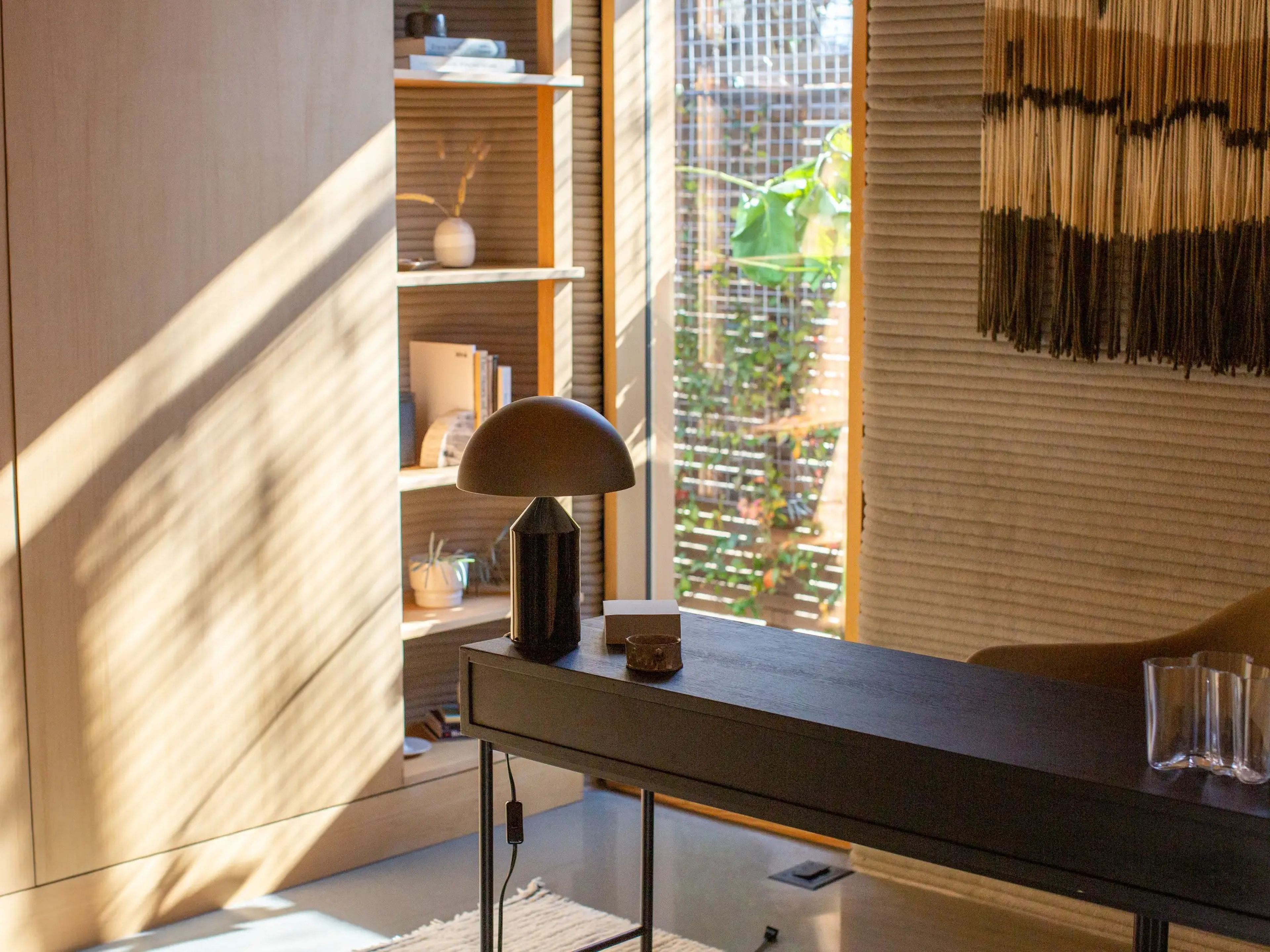 Light and shadows shining on a shelving storage in the home office.