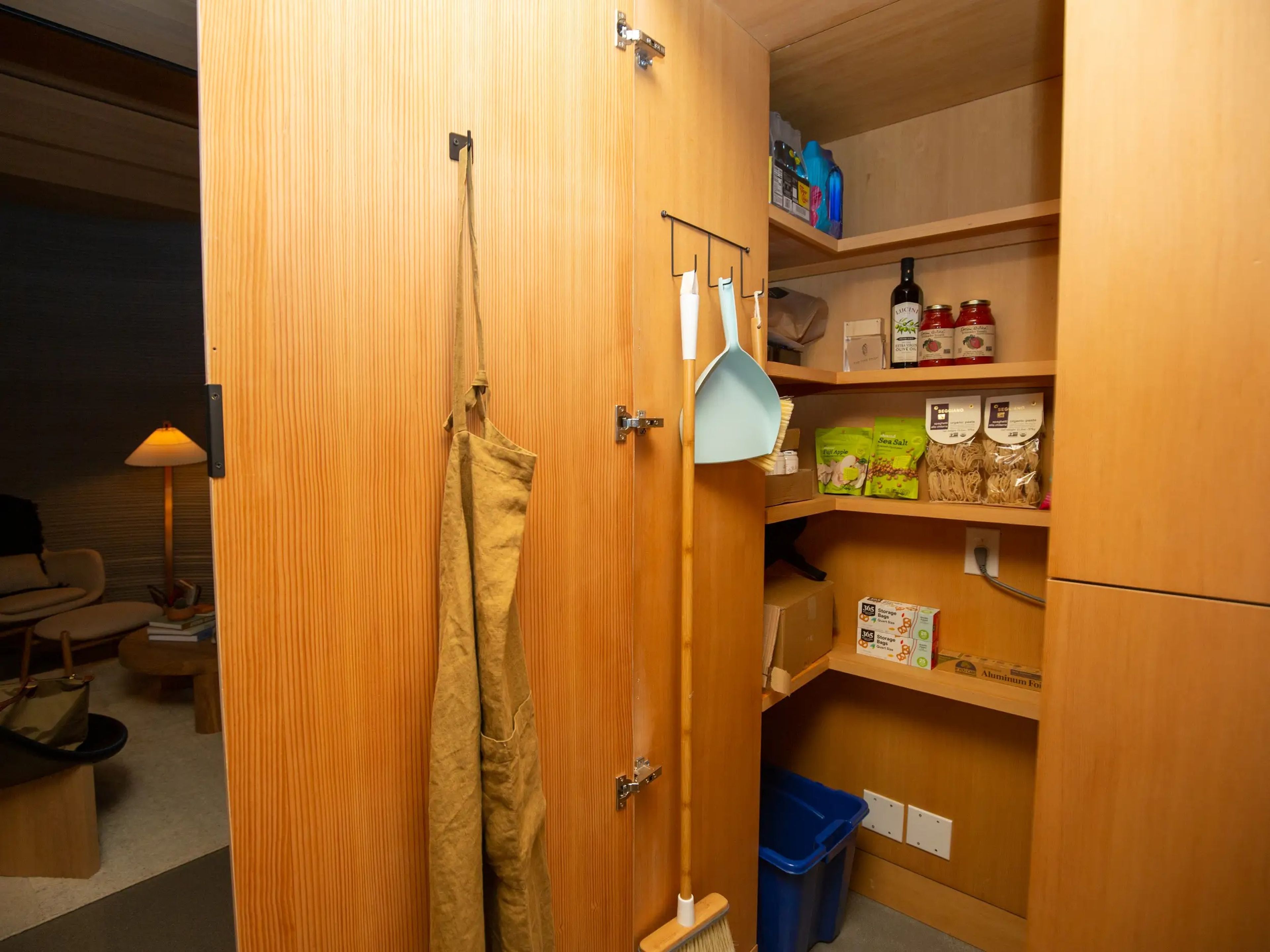 A walk-in pantry with food items.