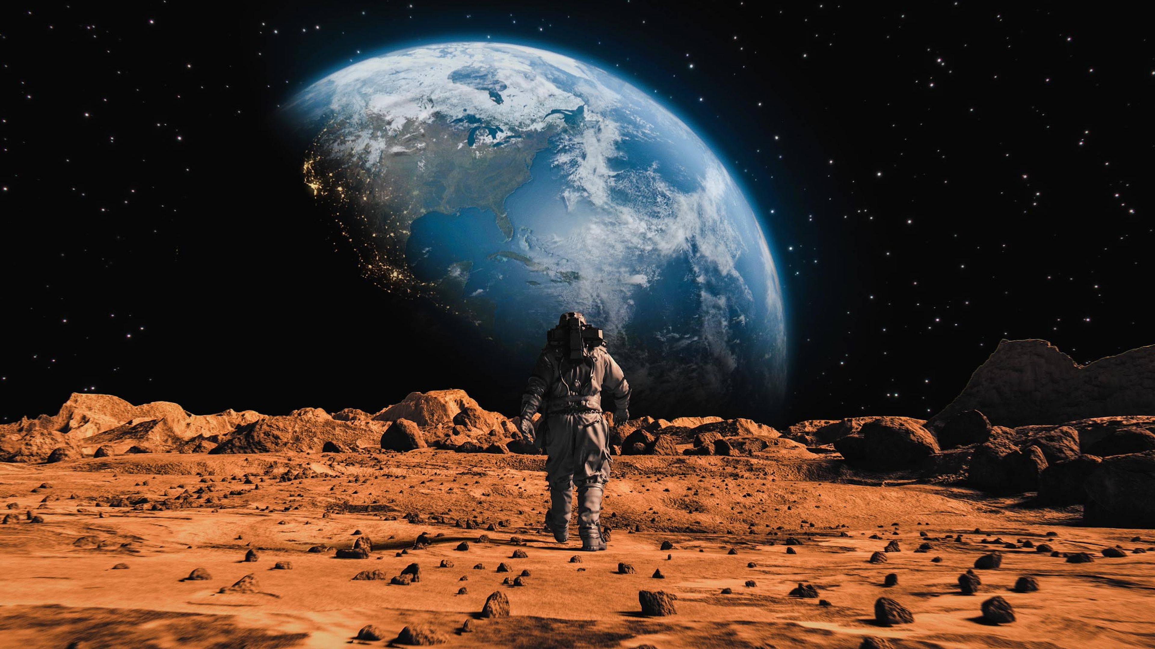 Astronauta en Marte mirando a la Tierra