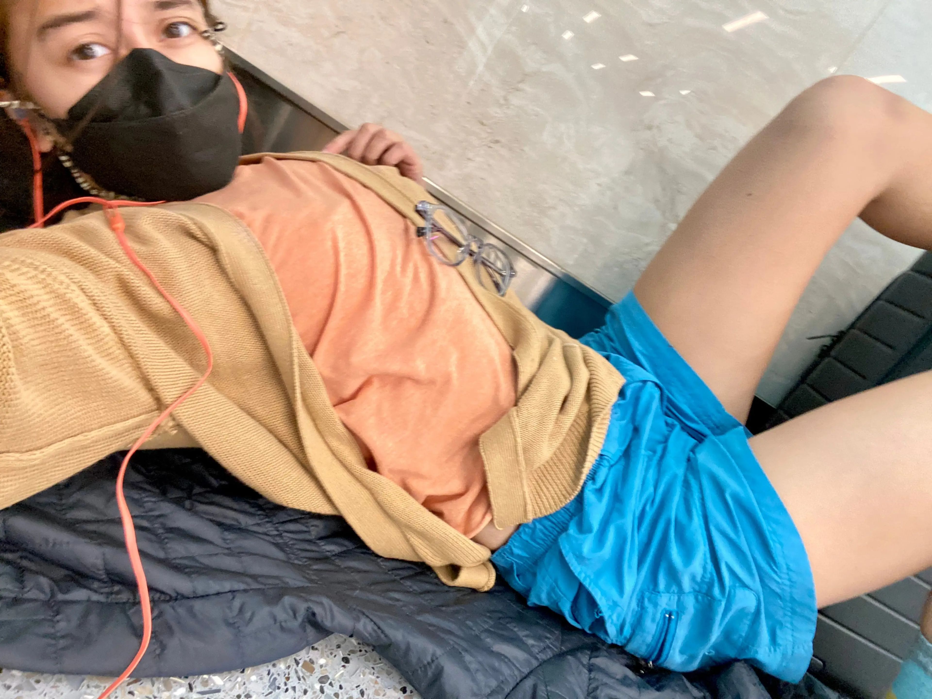 The author lays on the airport floor
