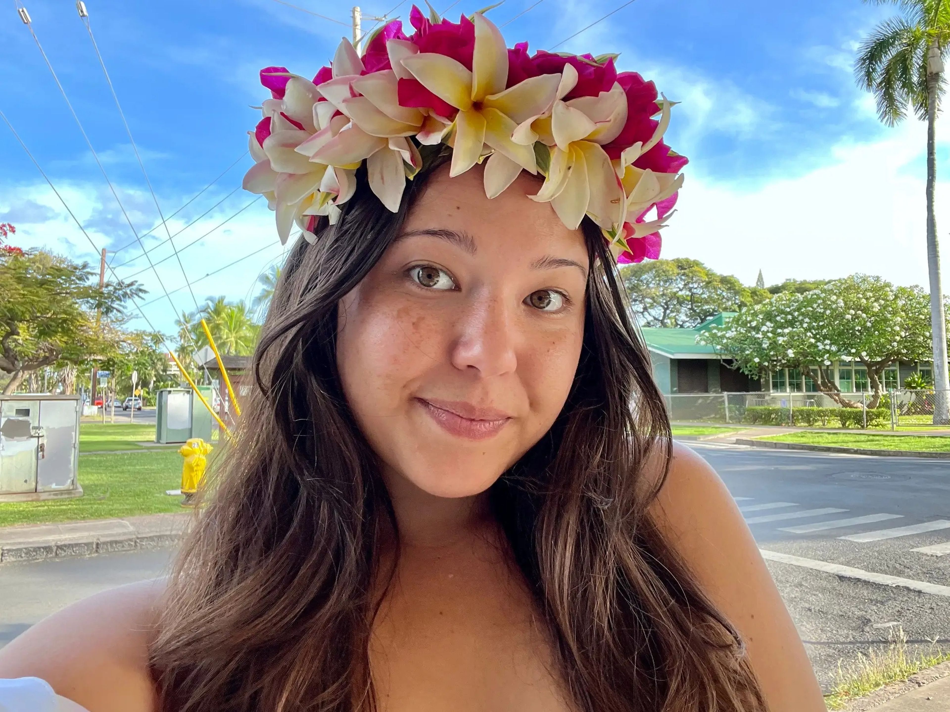 Ashley Probst smiling with lei on her head