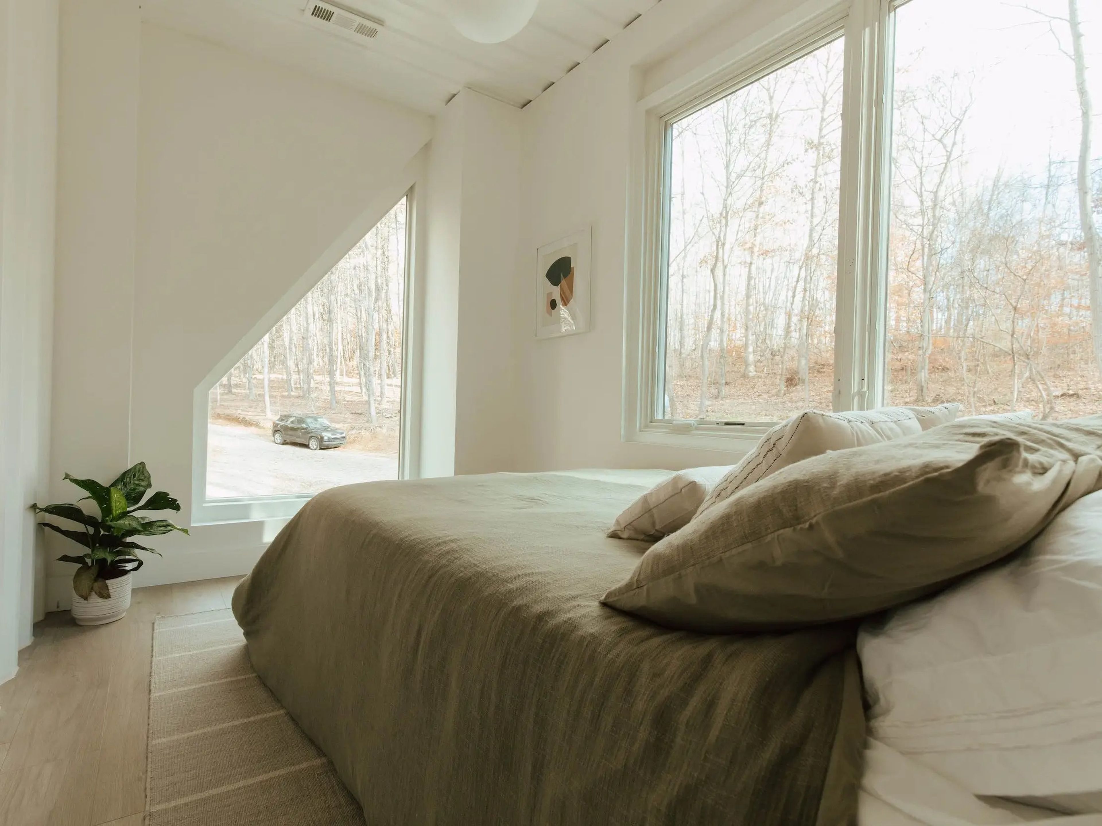 A bed inside a Hygge, a shipping container home.