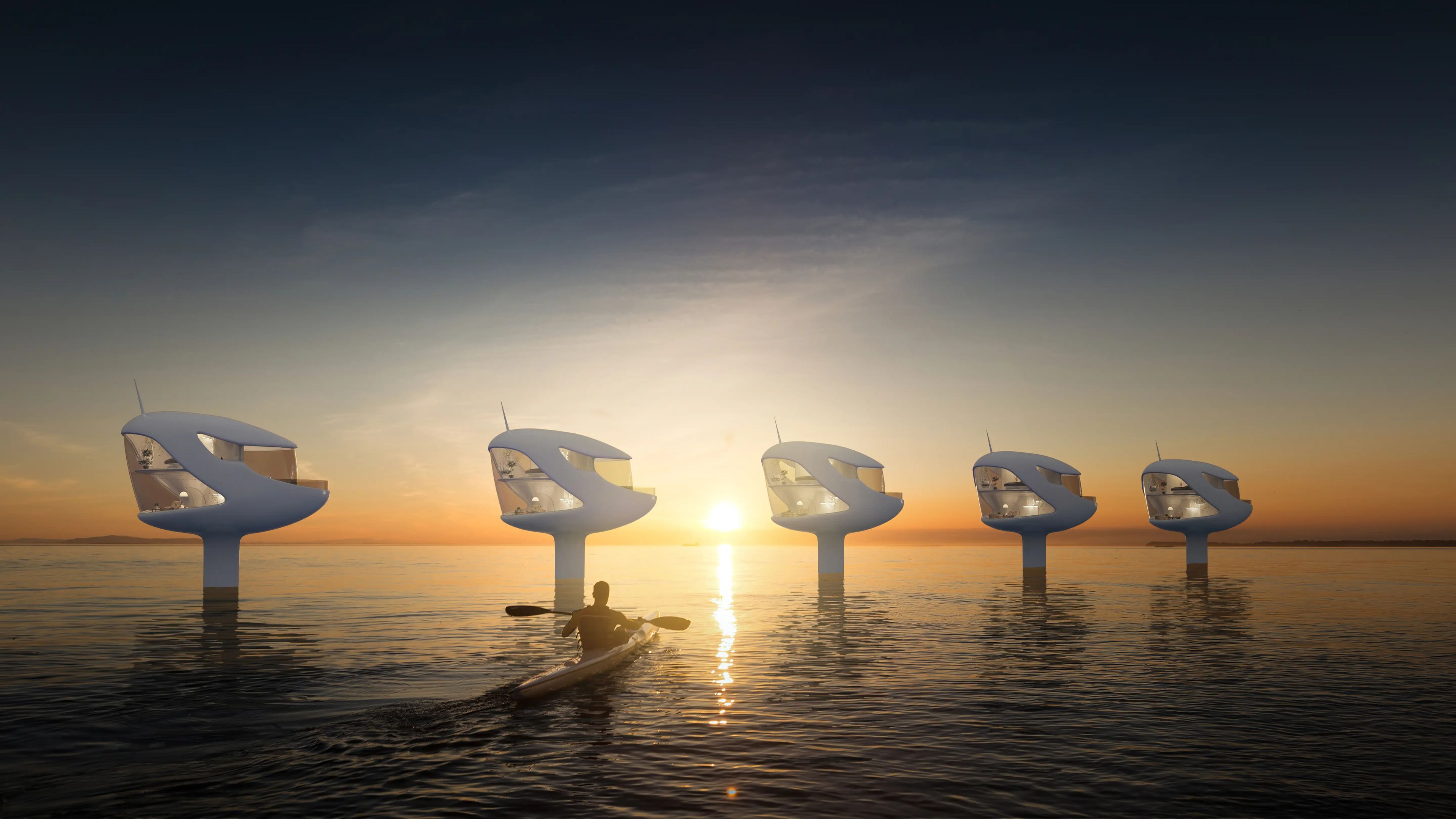 A man kayaking in front of five floating pods.