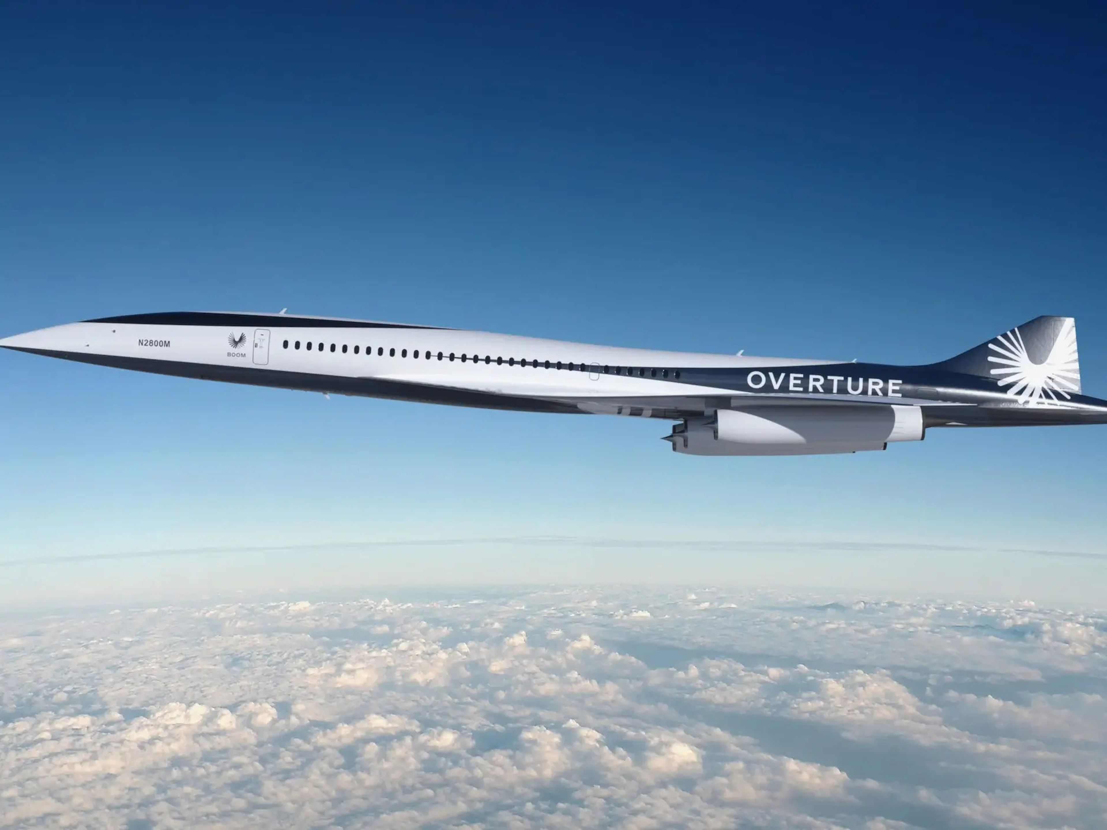 Boom Supersonic's Overture flying above clouds.