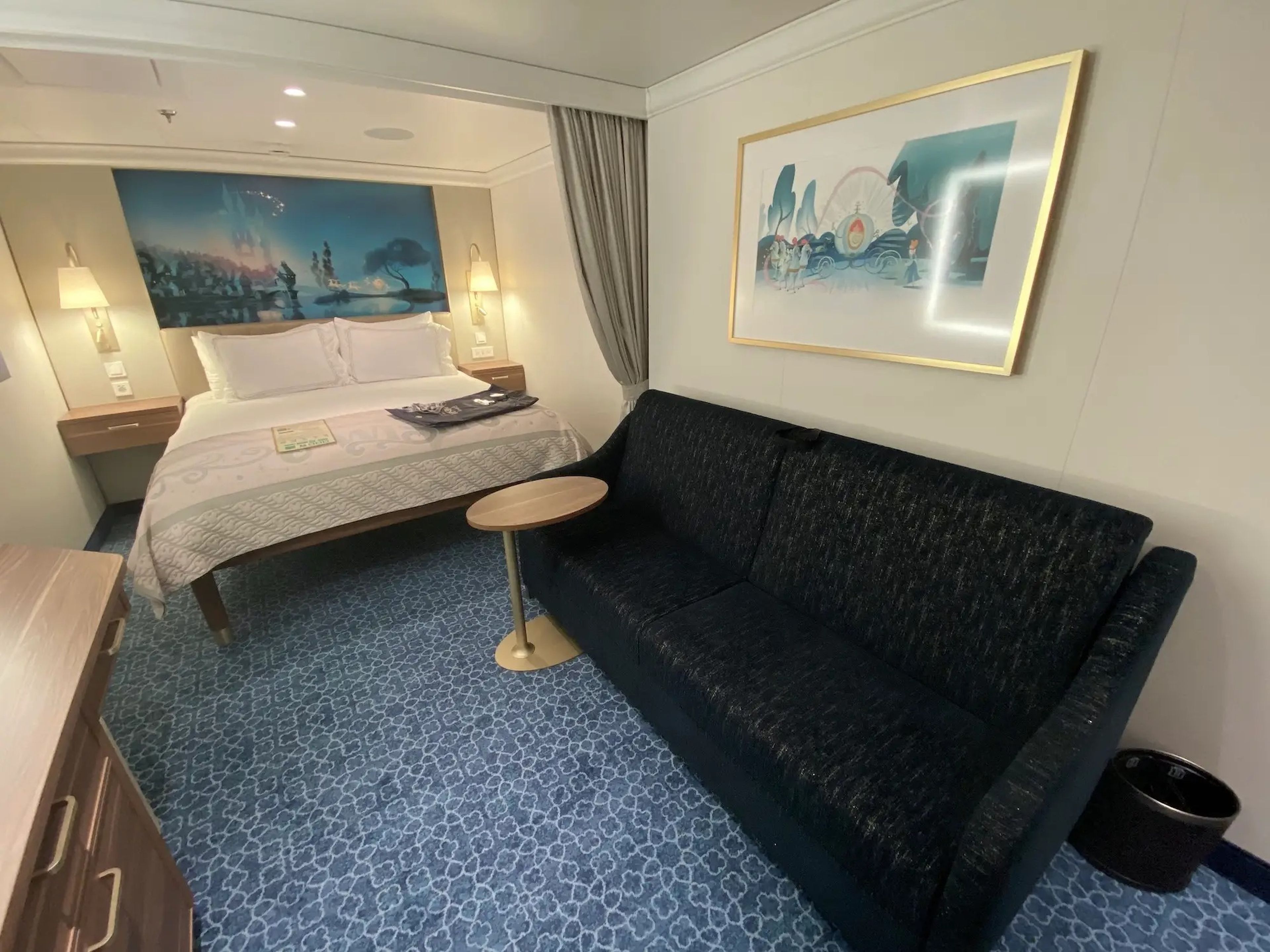 The convertible couch inside a standard stateroom aboard the Disney Wish.