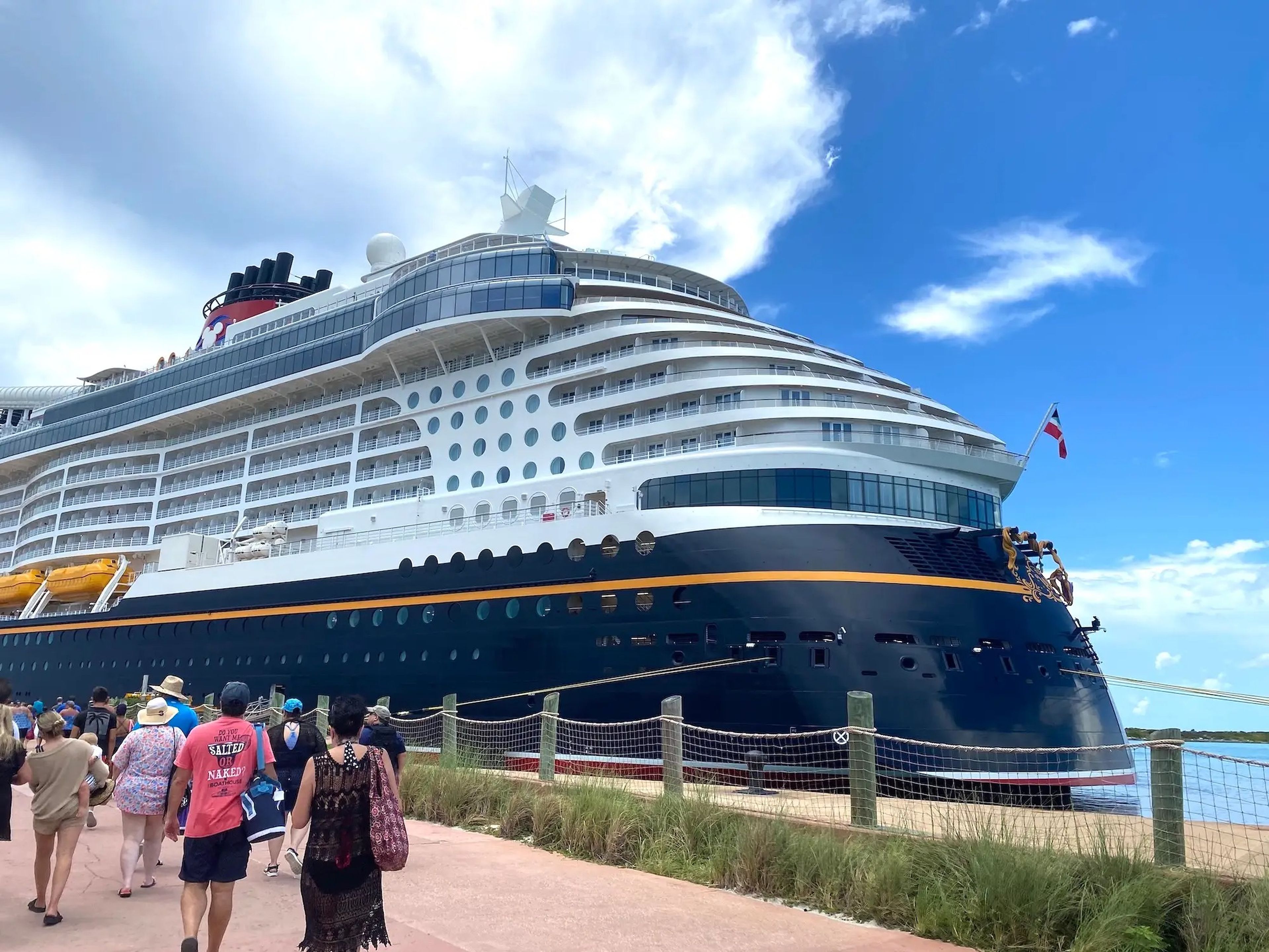 The Disney Wish cruise ship docked on Disney's private island Castaway Cay.