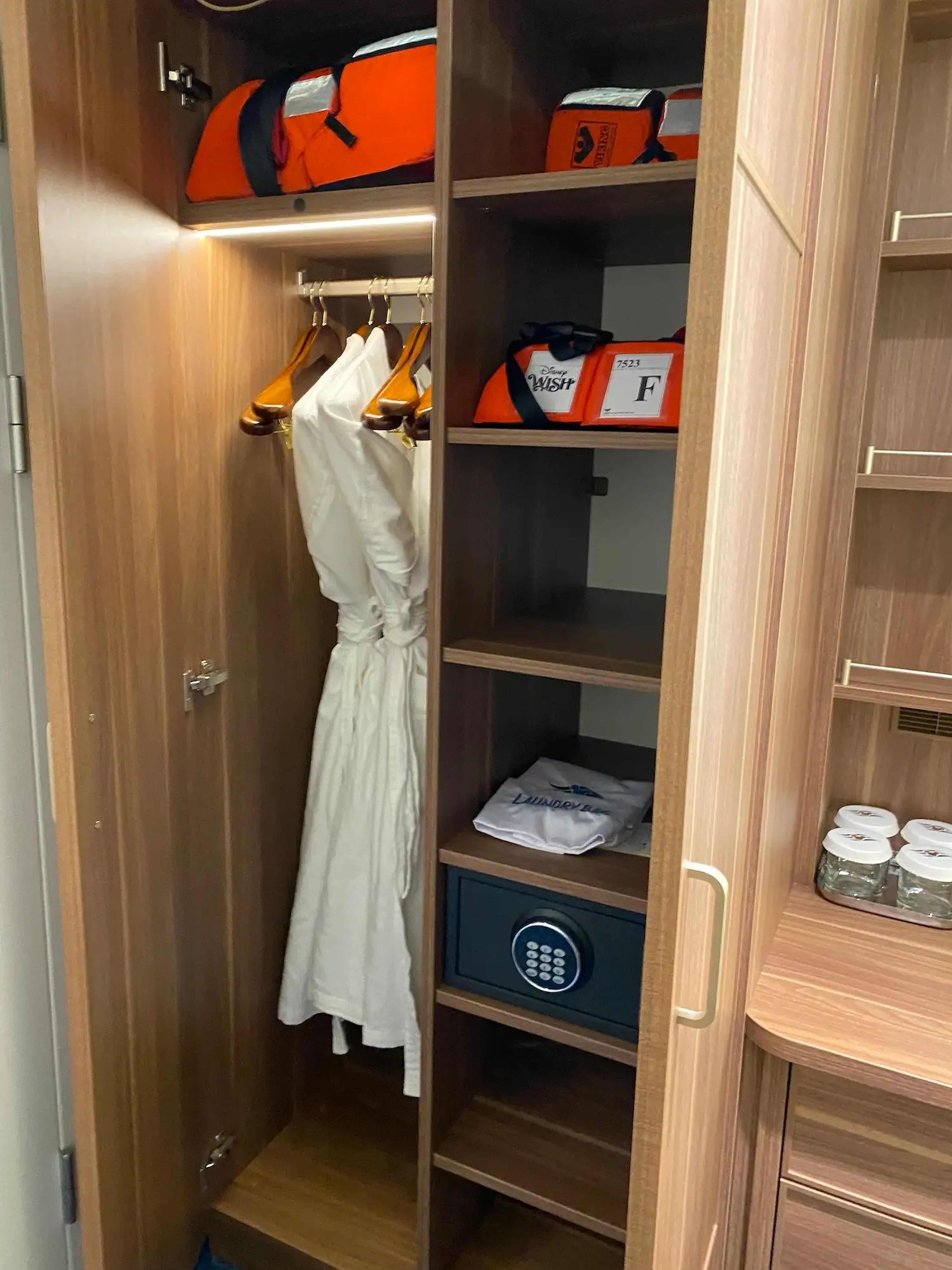 Inside the closet of the Disney Wish's standard staterooms.