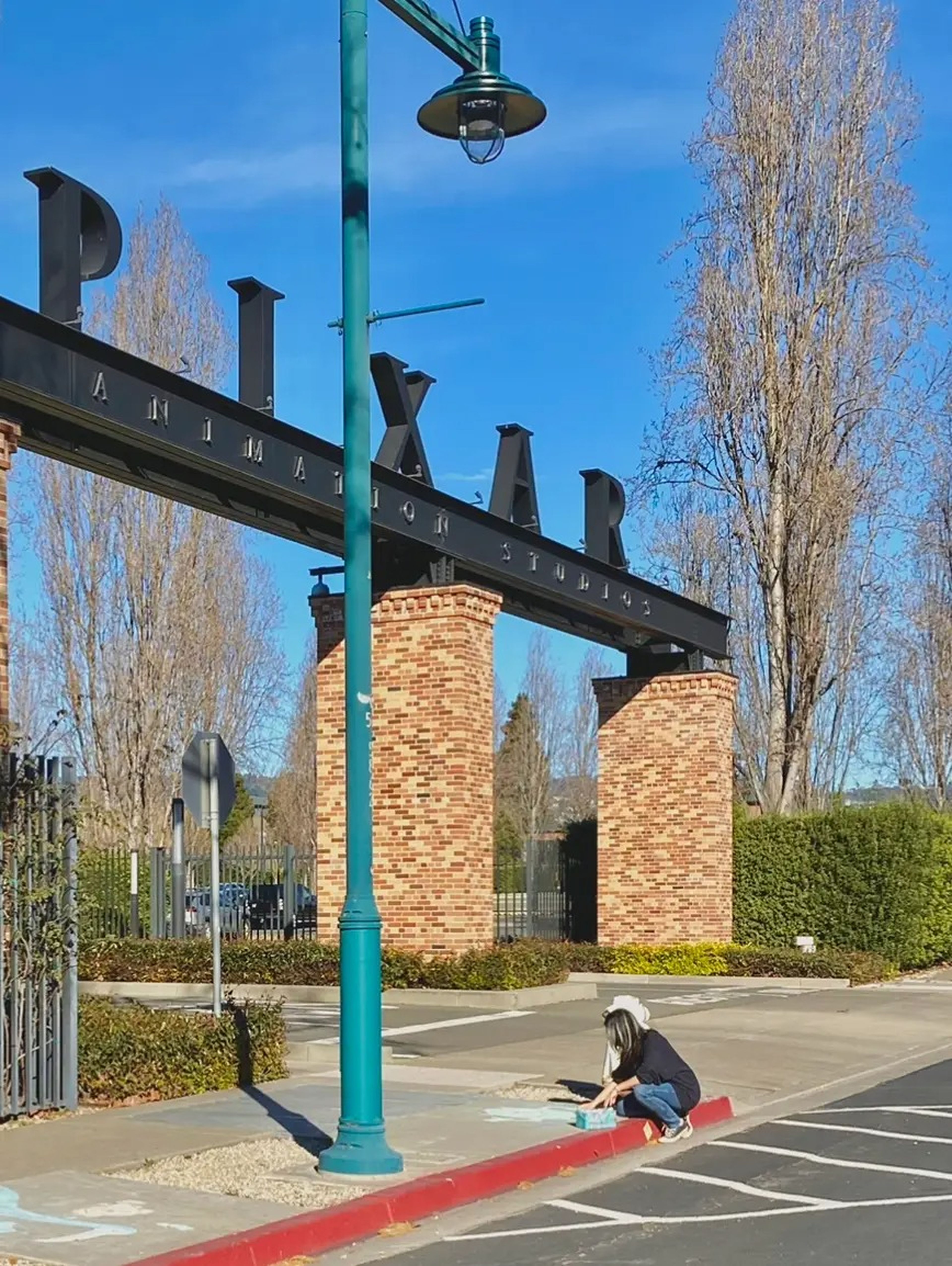 Plascencia drawing in front of Pixar's headquarters.
