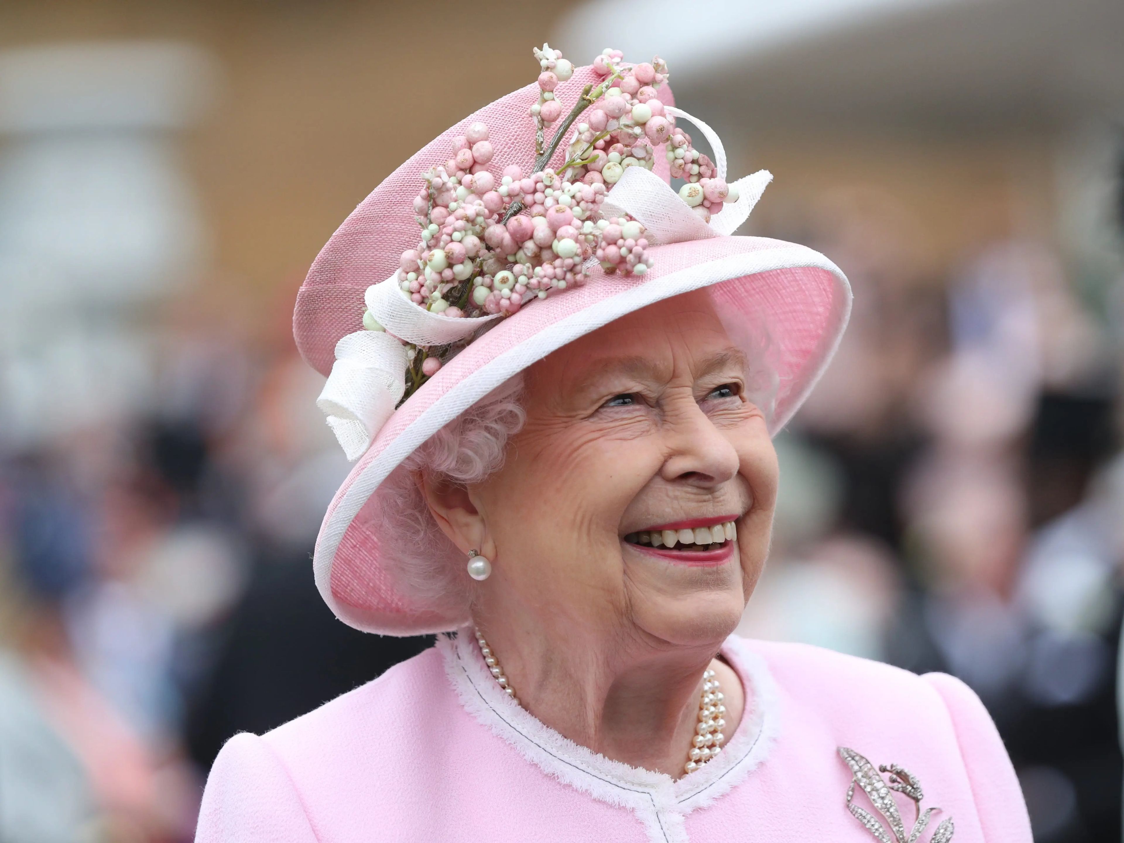Queen Elizabeth II smiling profit shot, shoulders up