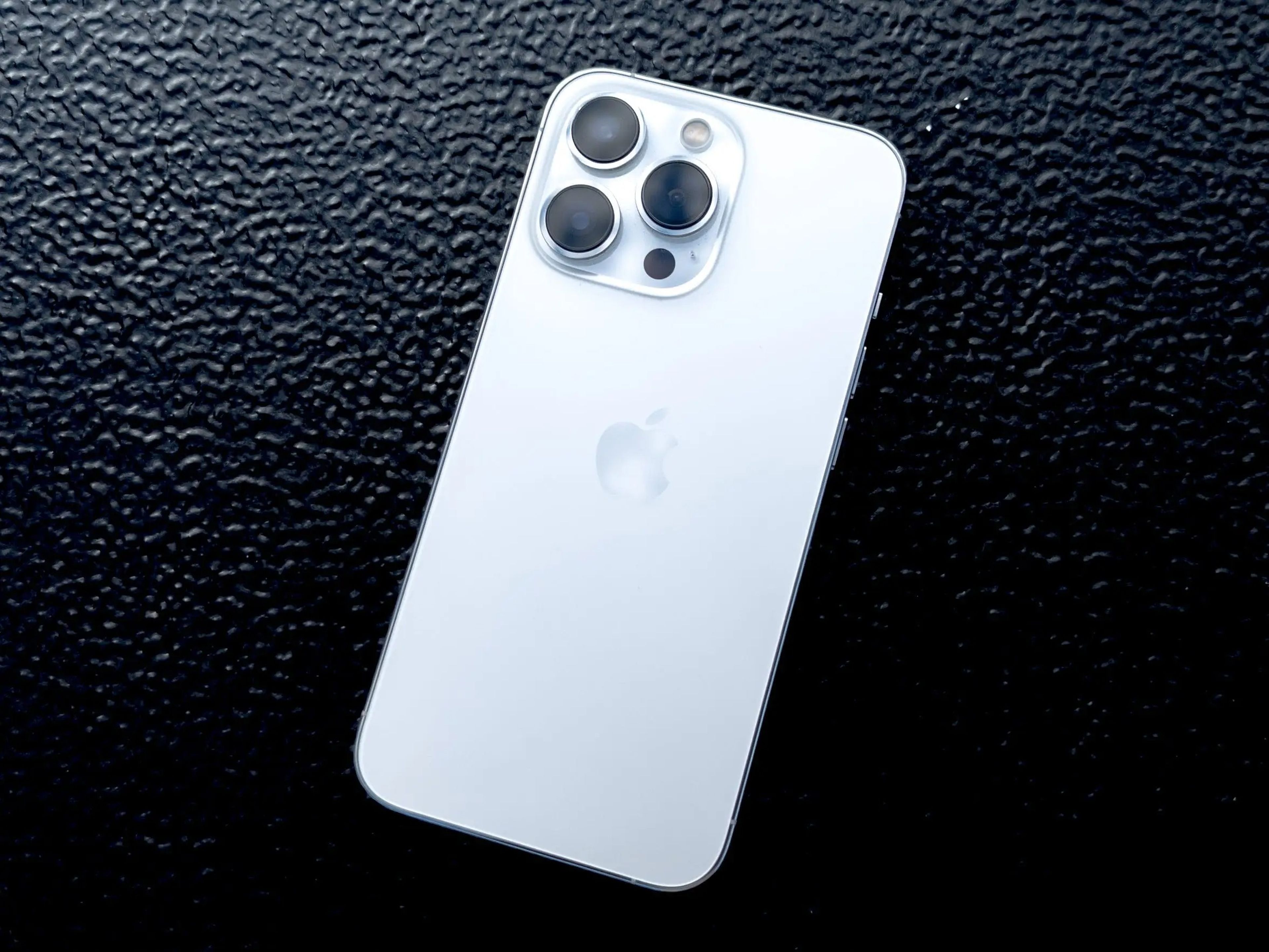 The rear of the iPhone 13 Pro in white