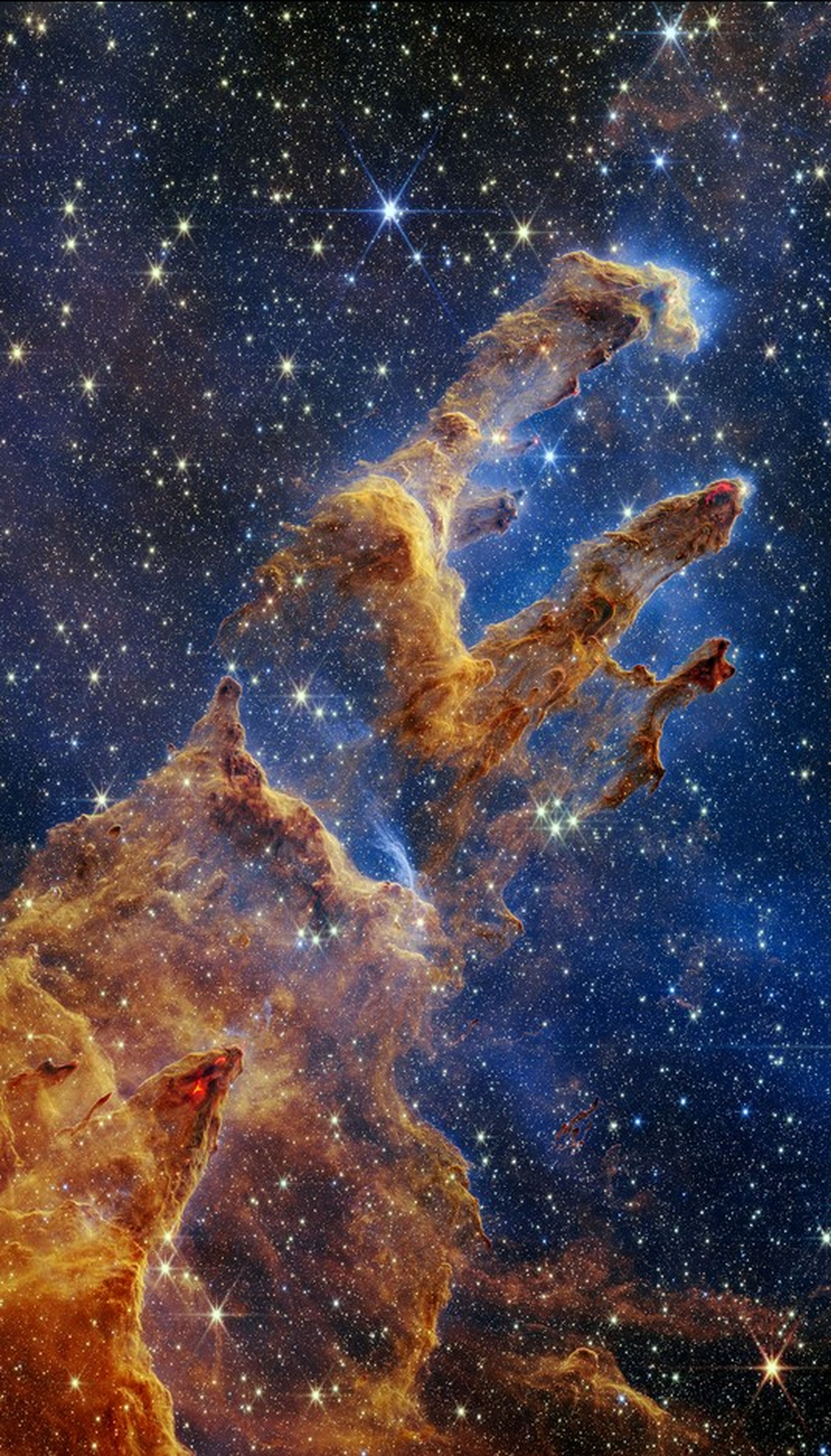 Los Pilares de la Creación en luz infrarroja cercana, fotografiados por el James Webb.