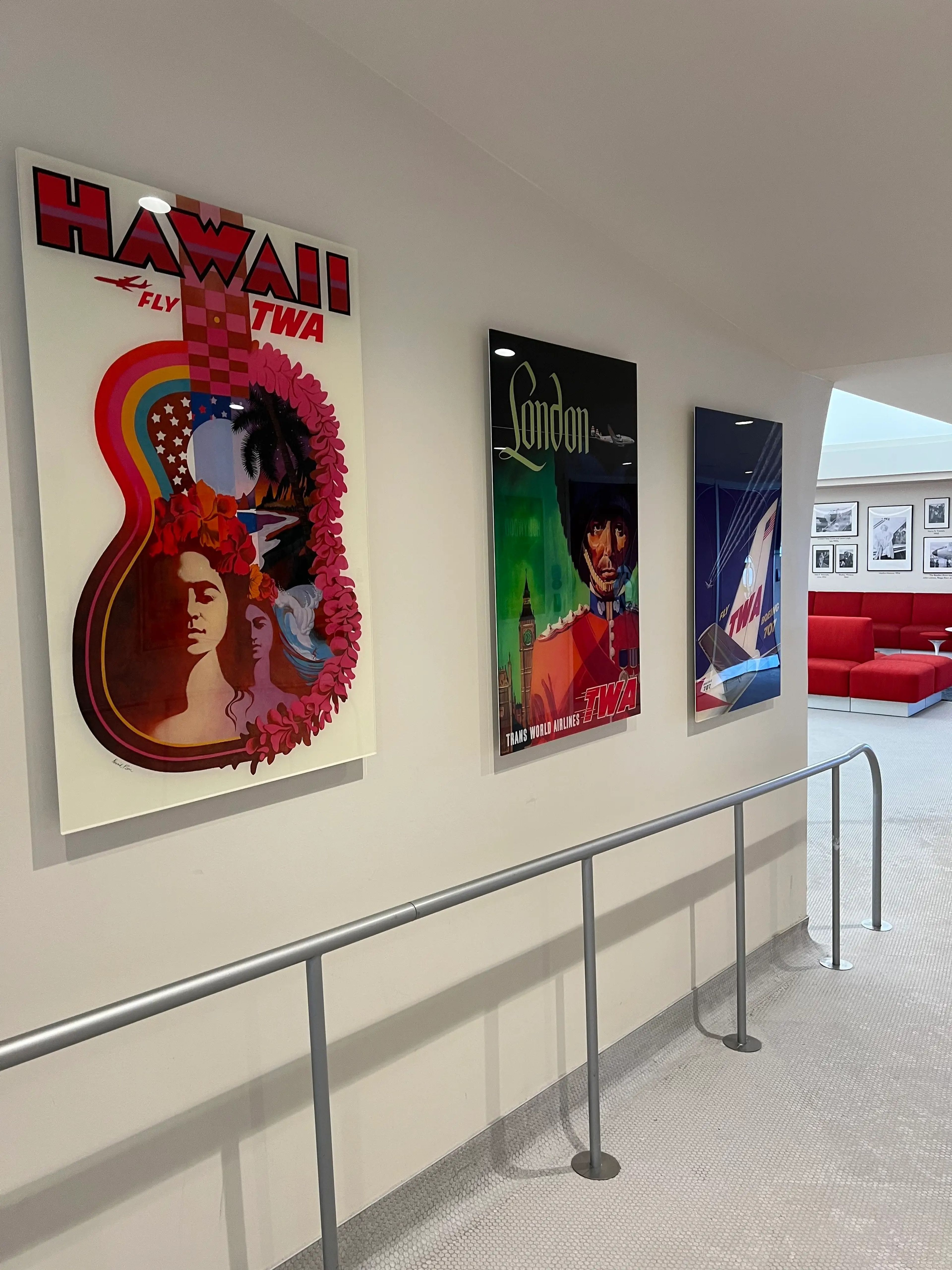 TWA Hotel posters on wall from different cities