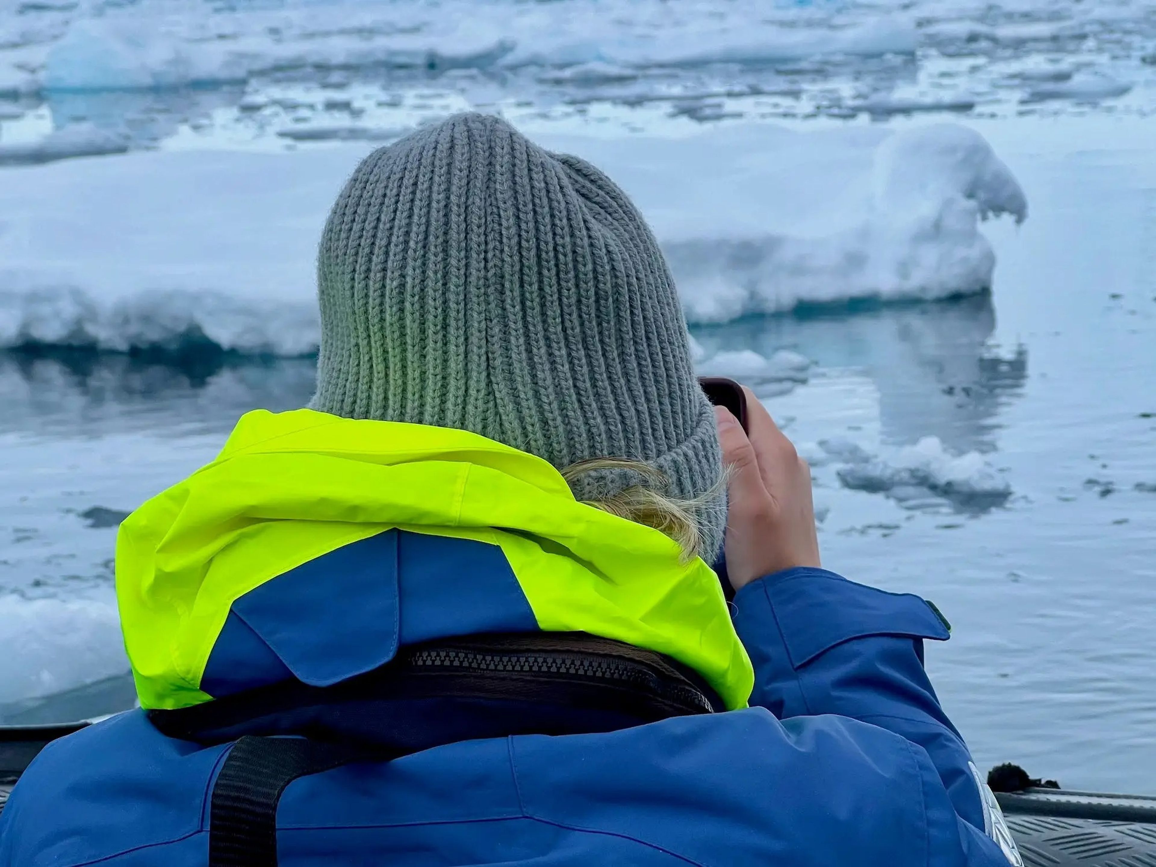One of my friends taking pictures of Antarctica from a zodiac.