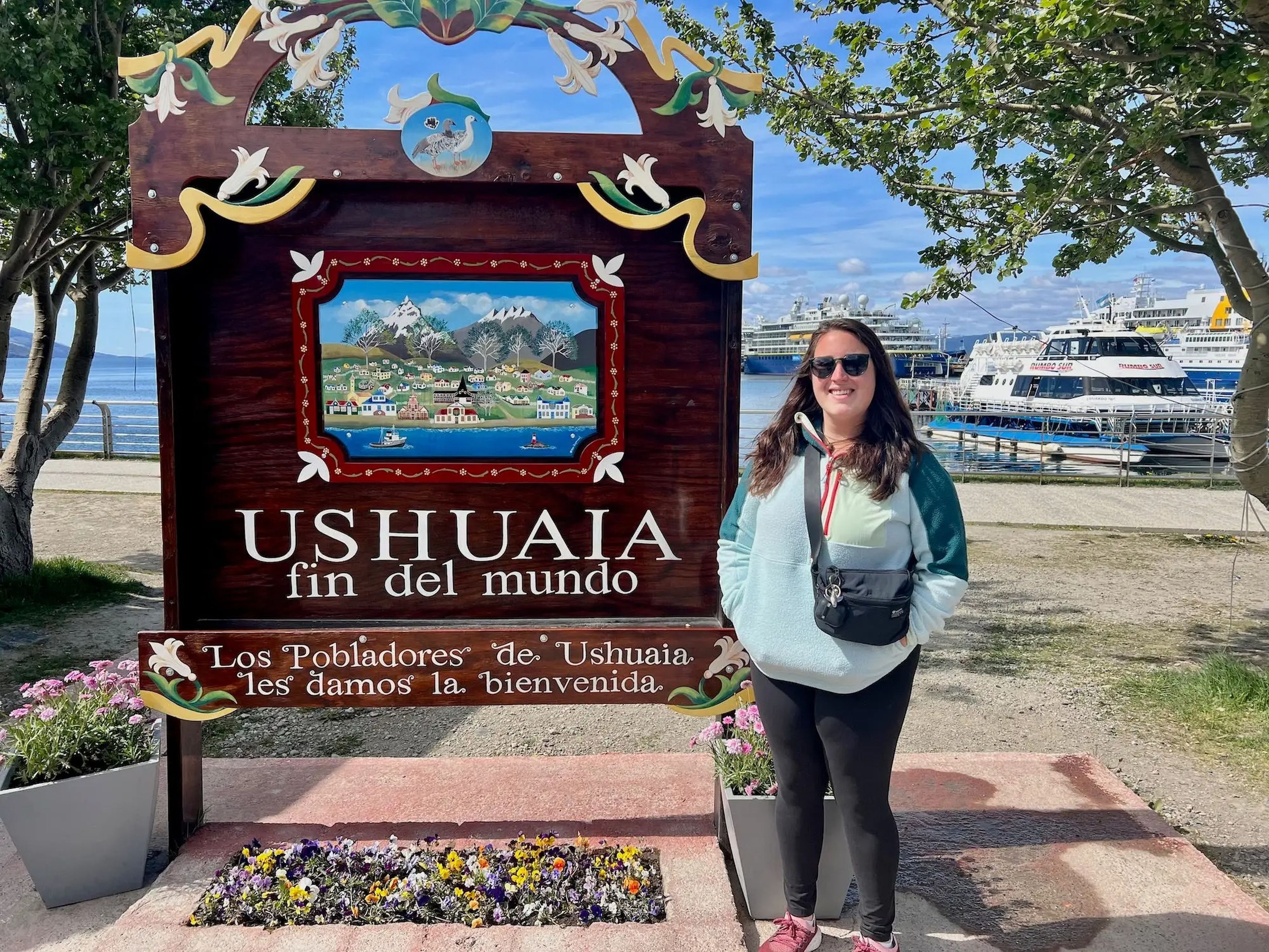 Standing with the "fin del mundo" sign in Ushuaia.