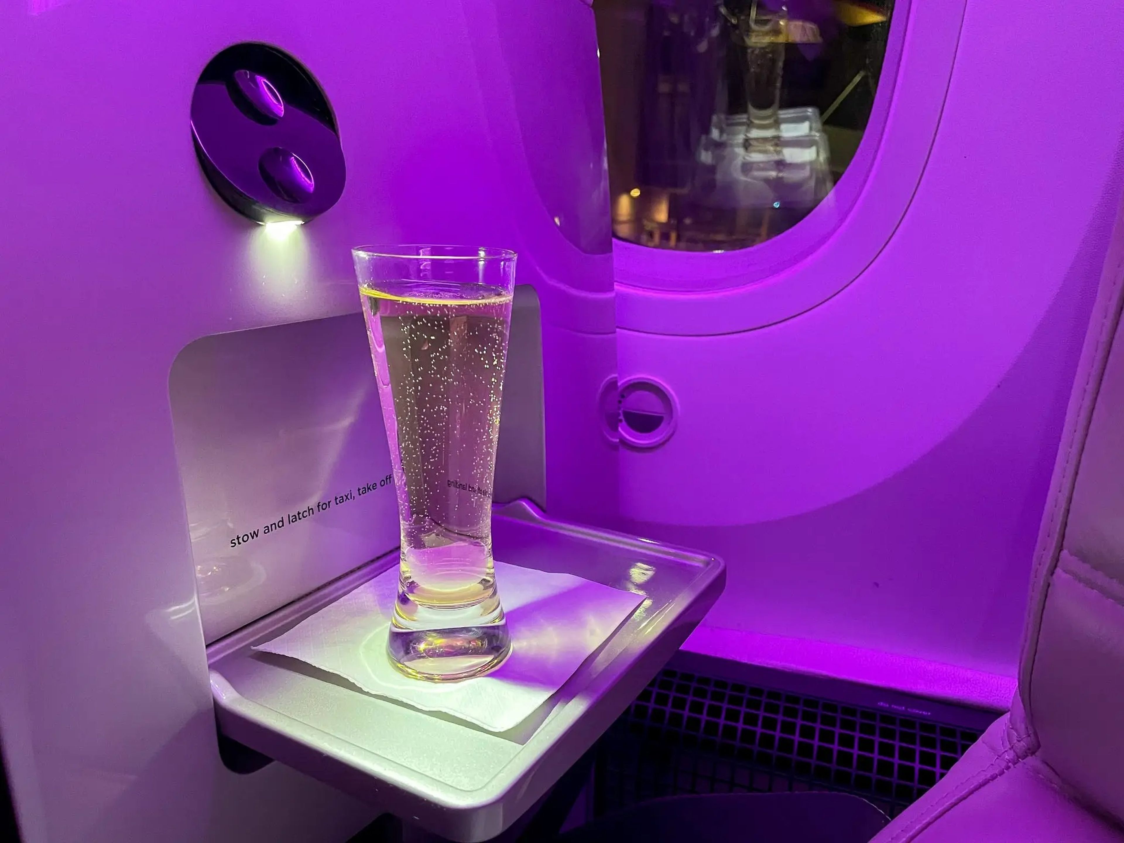 A glass of Champagne at the author's business-class seat.