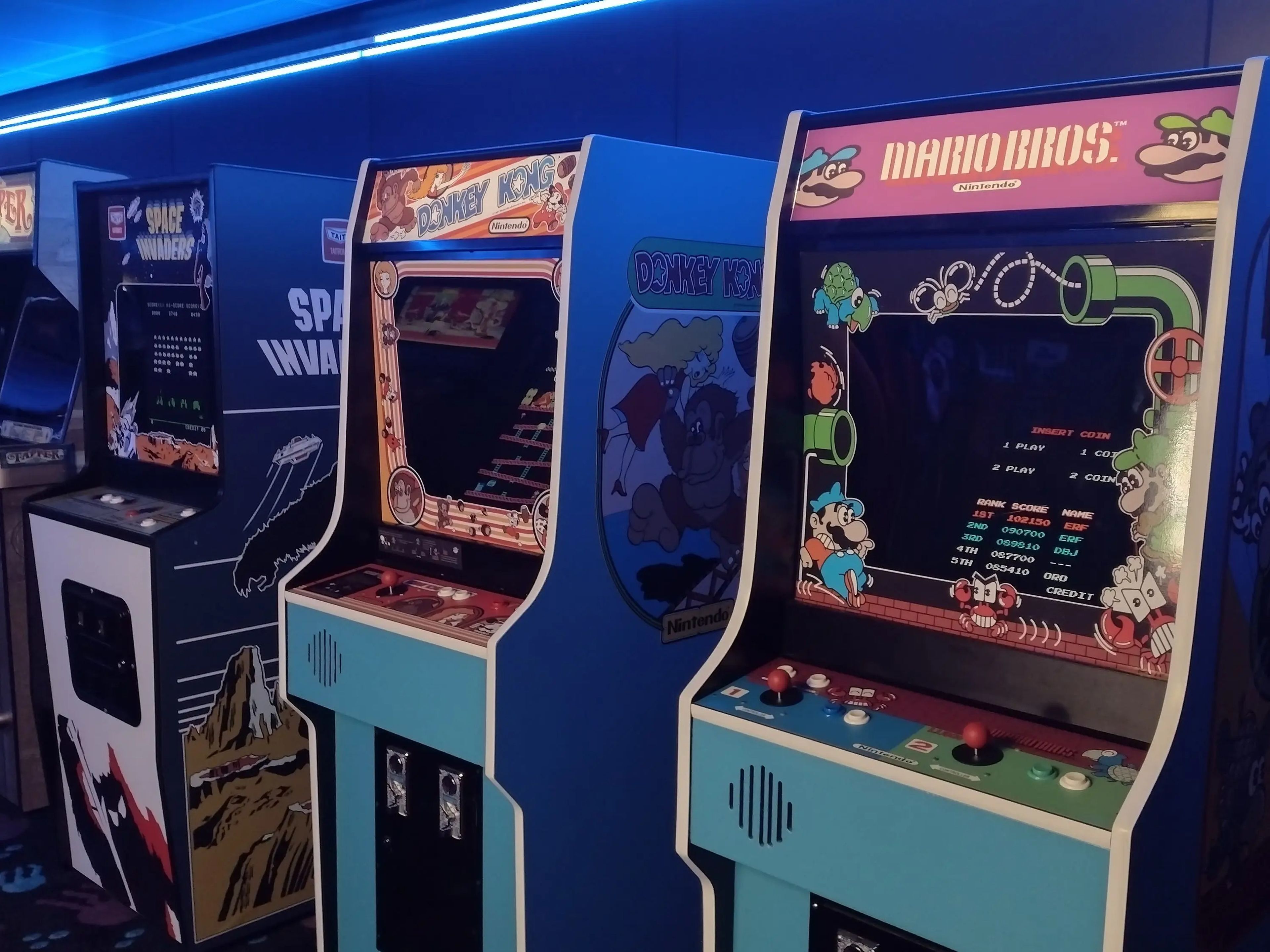 A row of vintage-looking arcade games.
