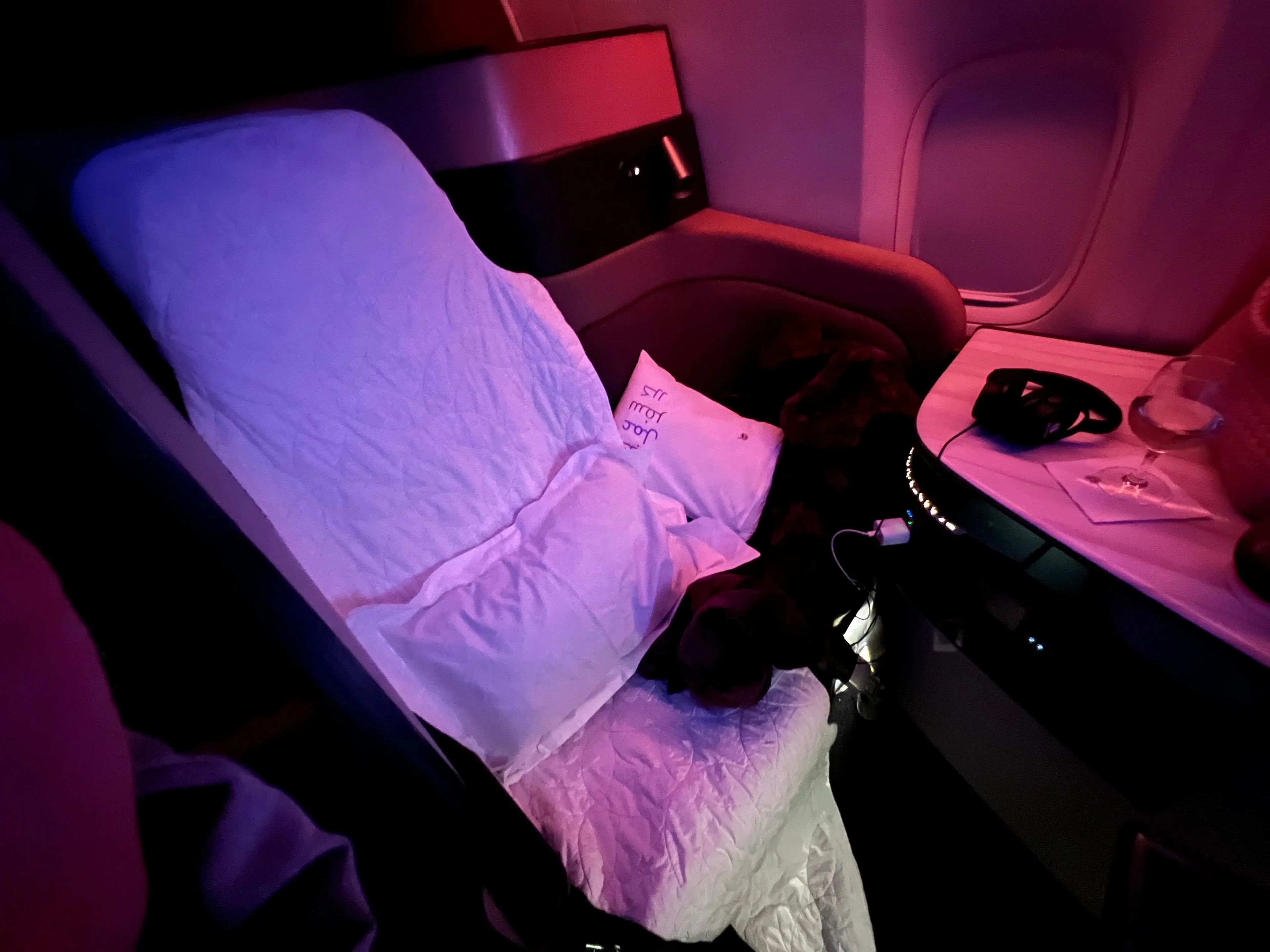 The seat was converted into a bed after takeoff.