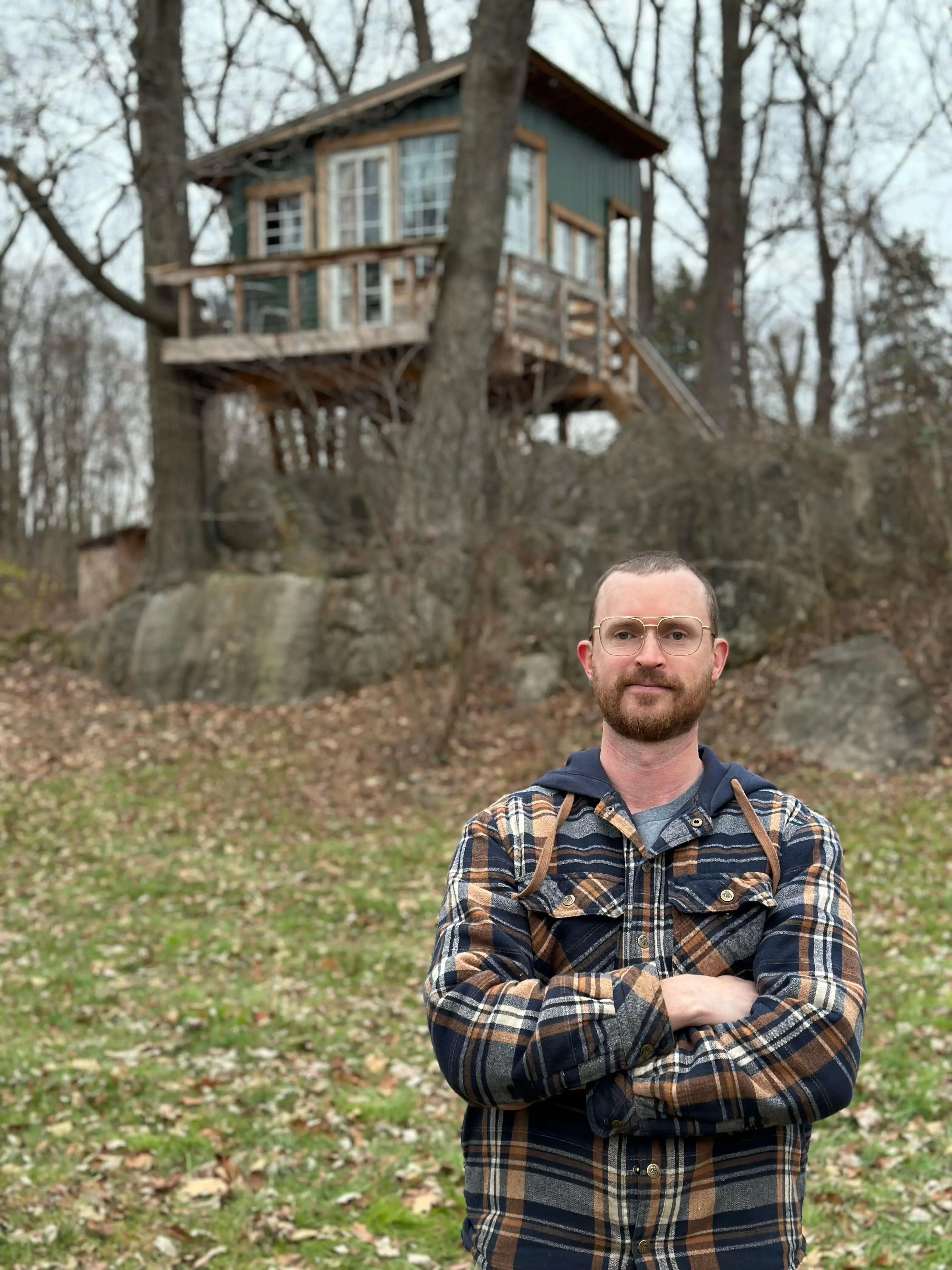 Will Sutherland in front of his treehouse Airbnb