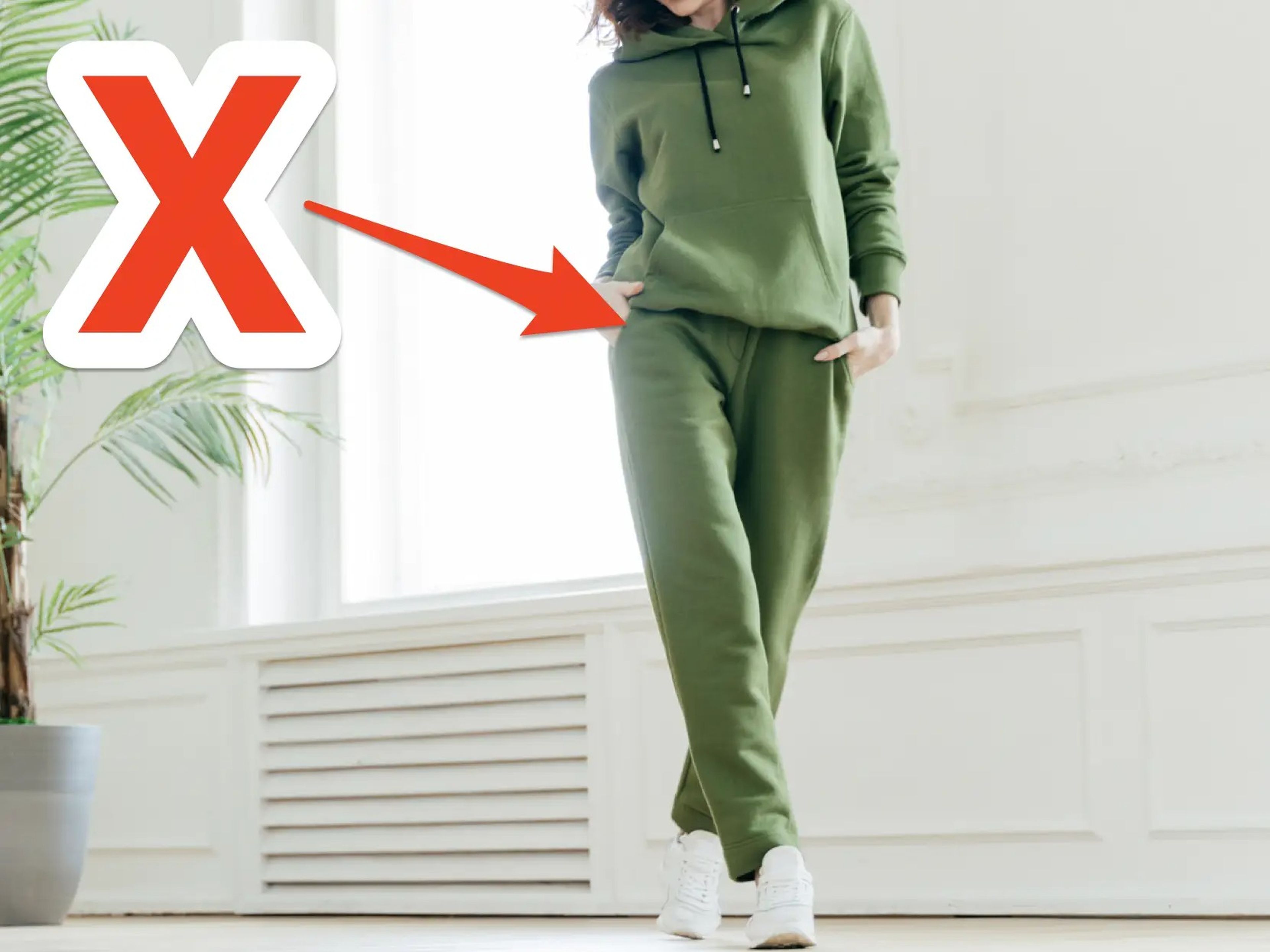 woman wearing green sweatsuit with skitch