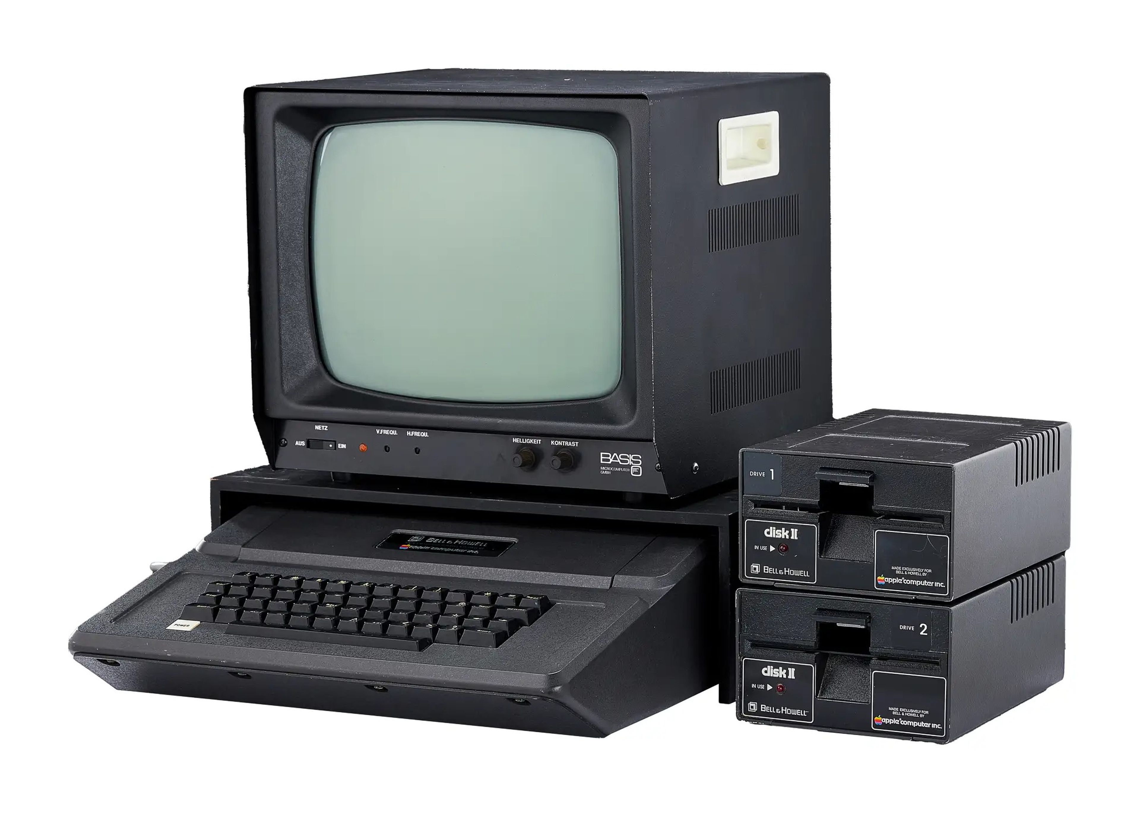 1979 Bell & Howell "Apple II Plus" computer with a green screen monitor and two drives next to it