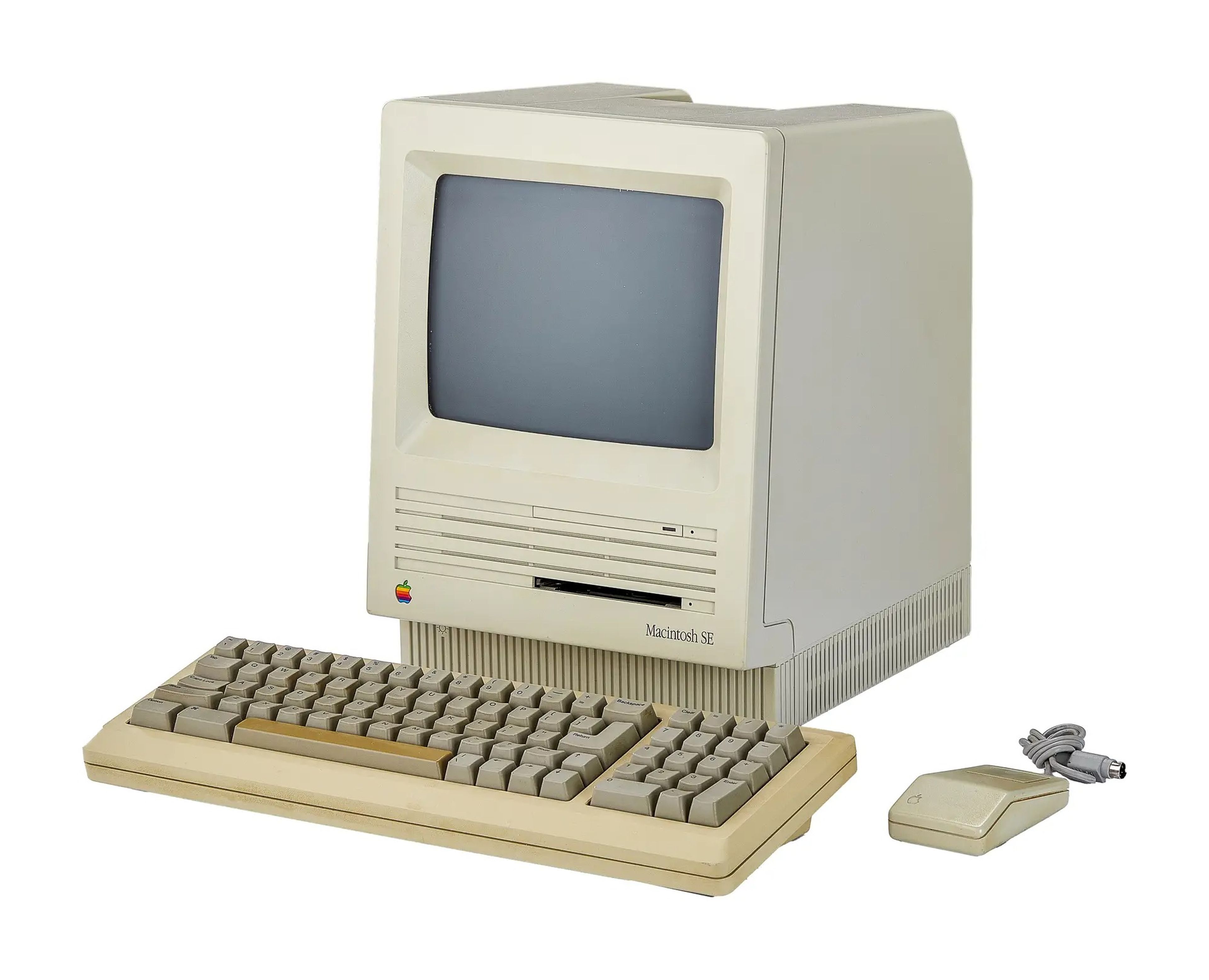 1986 Apple Macintosh SE computer including a keyboard and mouse