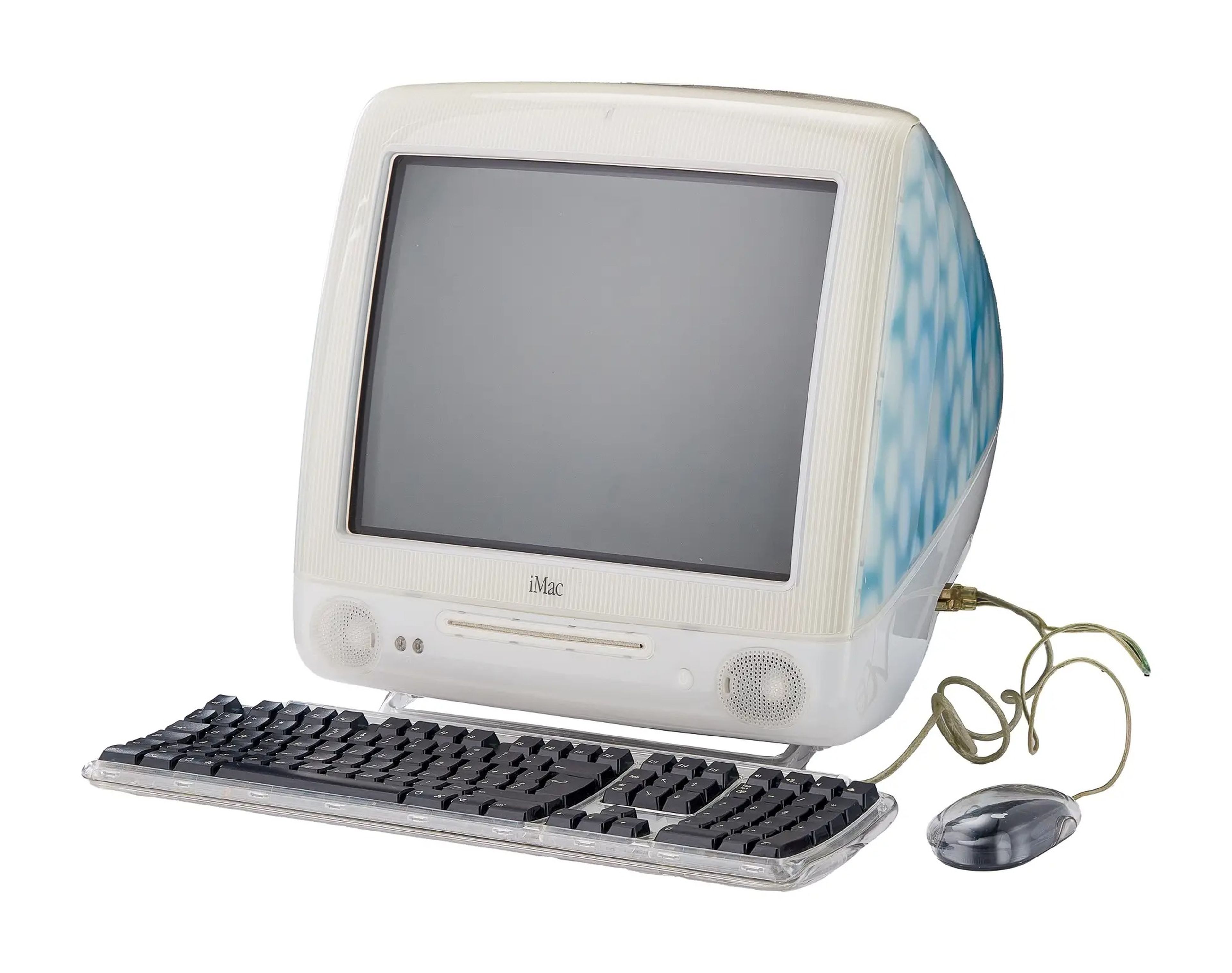 2001 iMac G3 with blue detailing, a keyboard, and mouse with wire