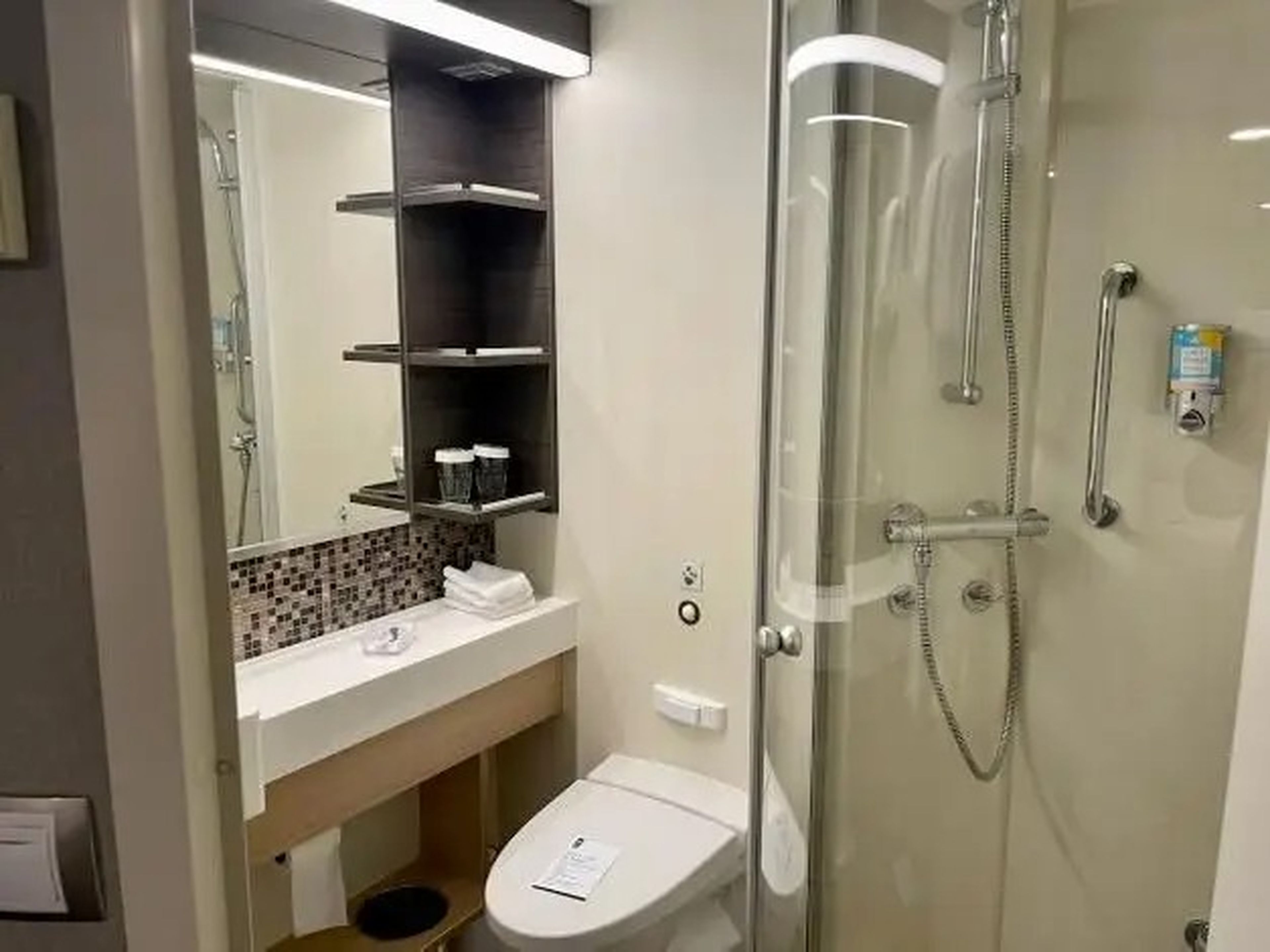 bathroom of interior carbin on symphony of the seas, view of sink, toilet, shower