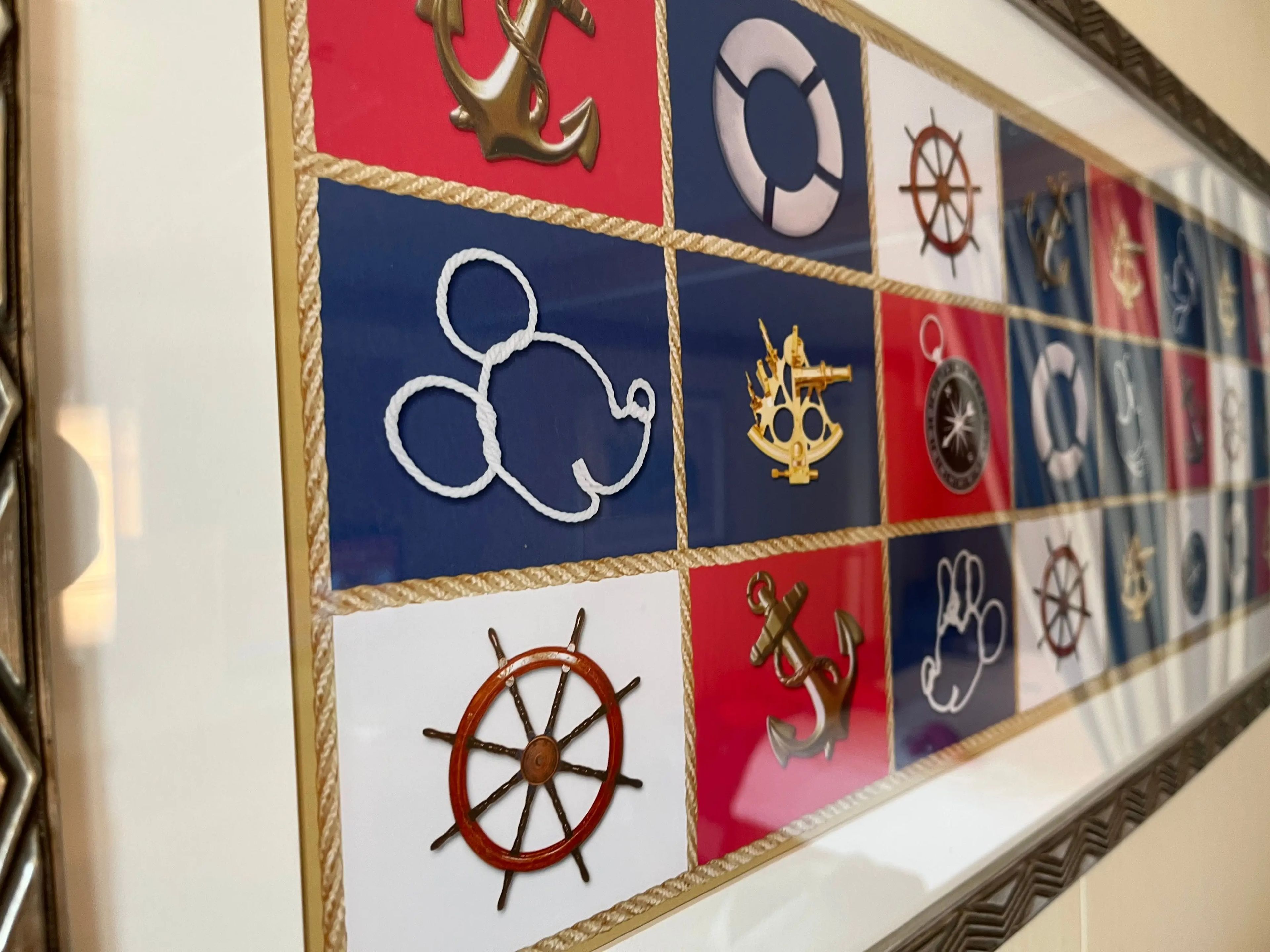 closeup shot of a nautical mickey mouse themed wall decor in a family stateroom on a disney cruise