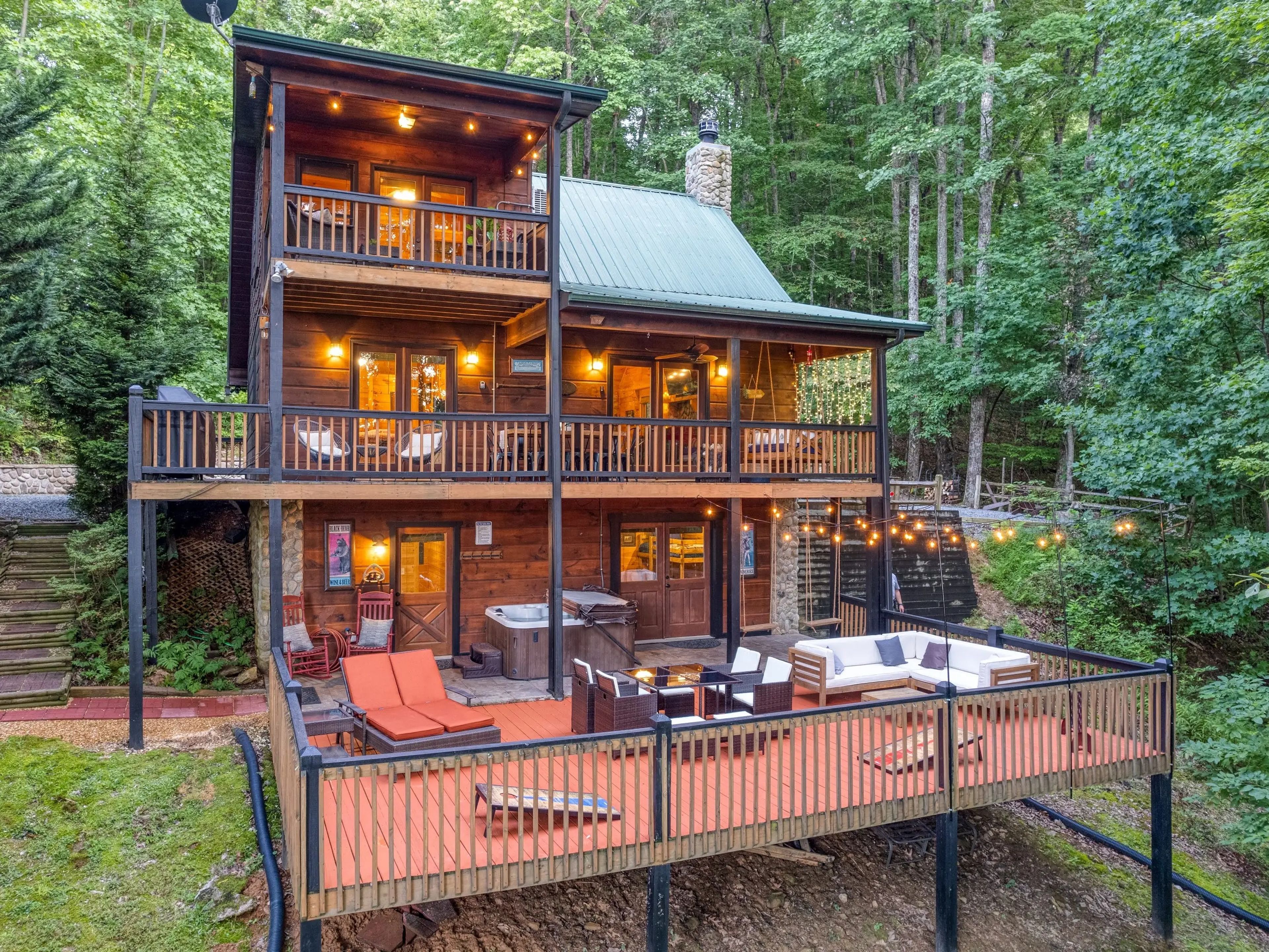 Exterior shot of Airbnb cabin's three floors and decks in Blue Ridge, Georgia