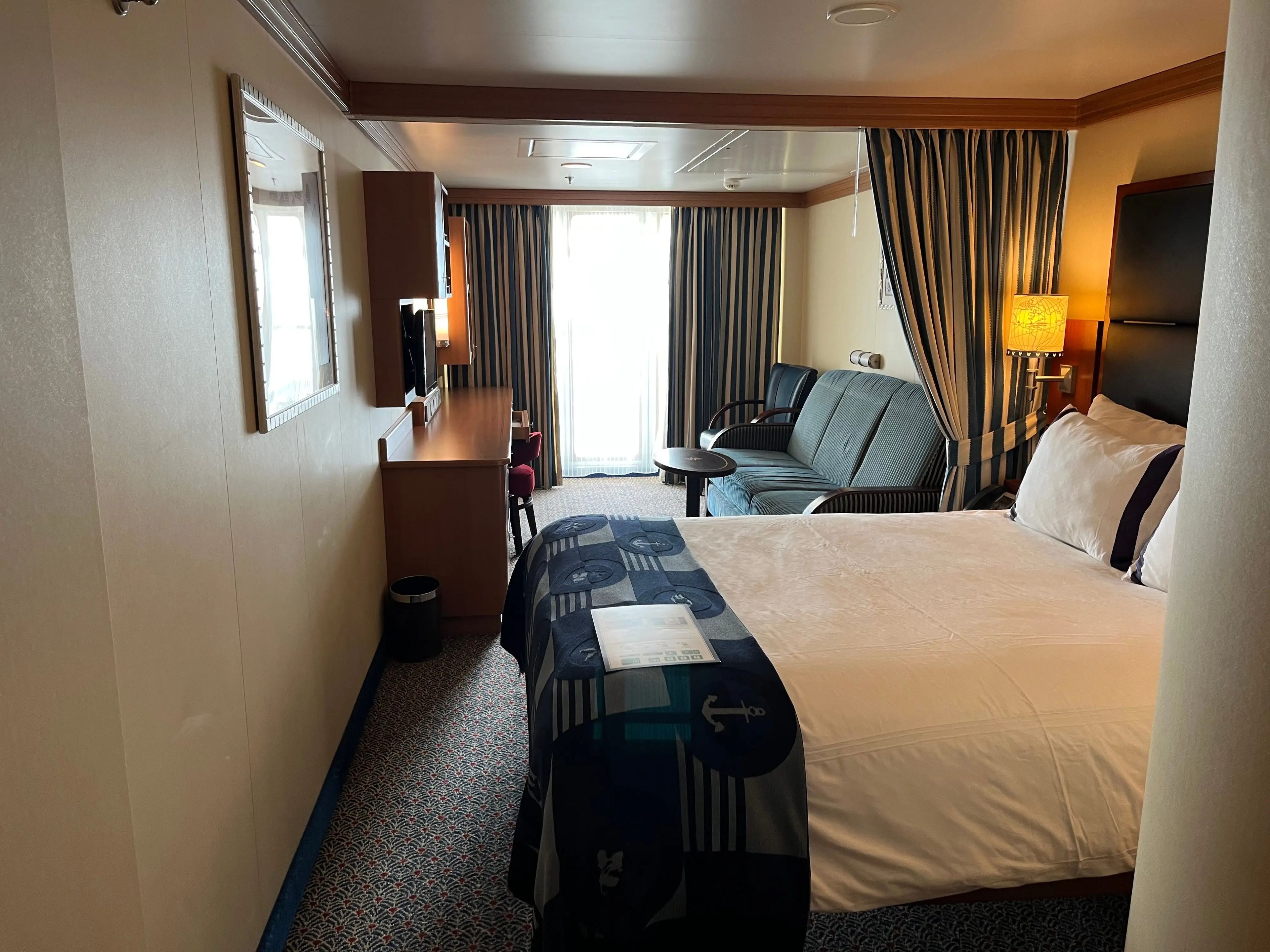 full view of a oceanview family stateroom with a queen bed on a disney fantasy cruise ship