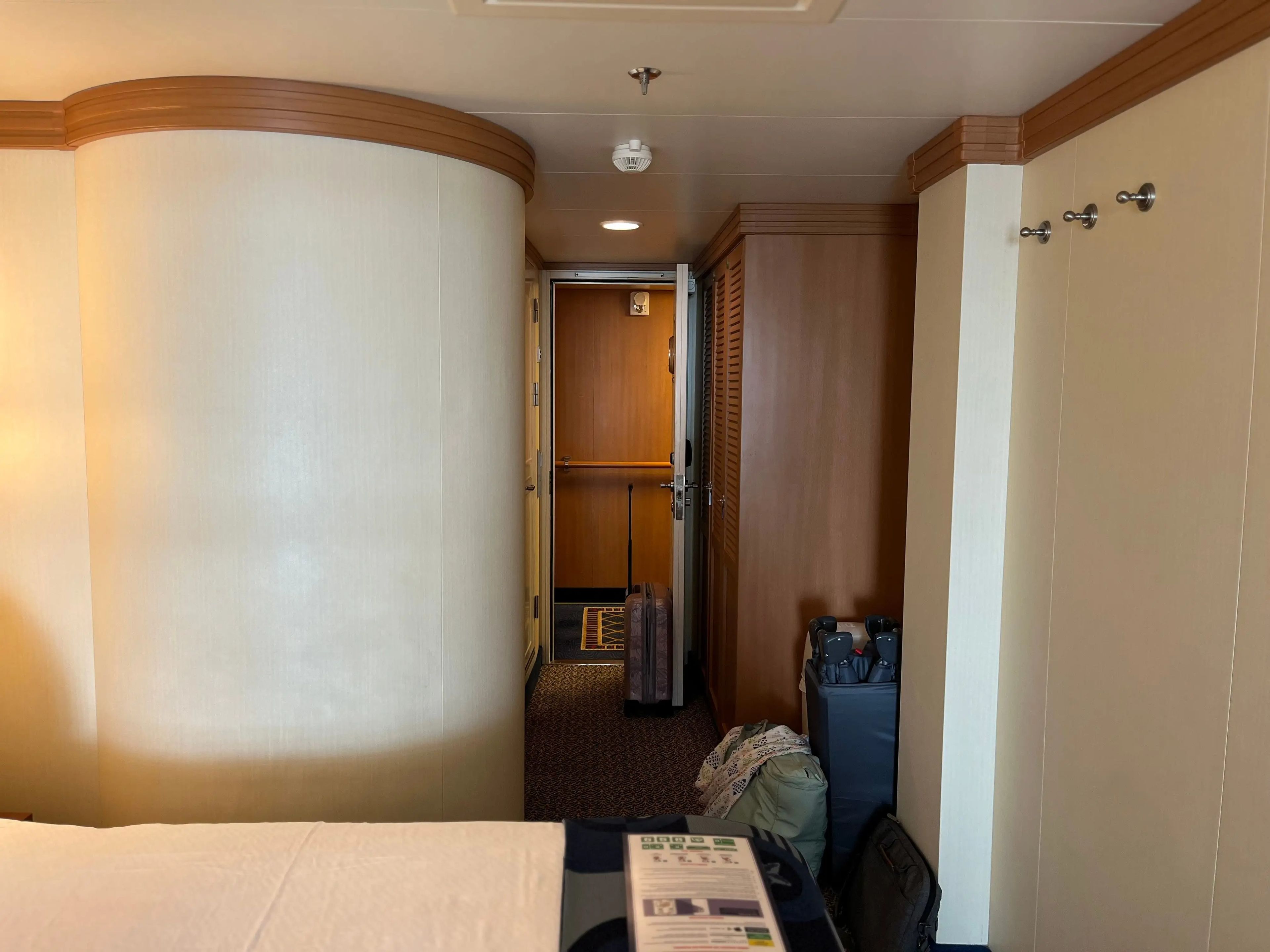 rounded wall outside a bathroom in a family stateroom on a disney cruise