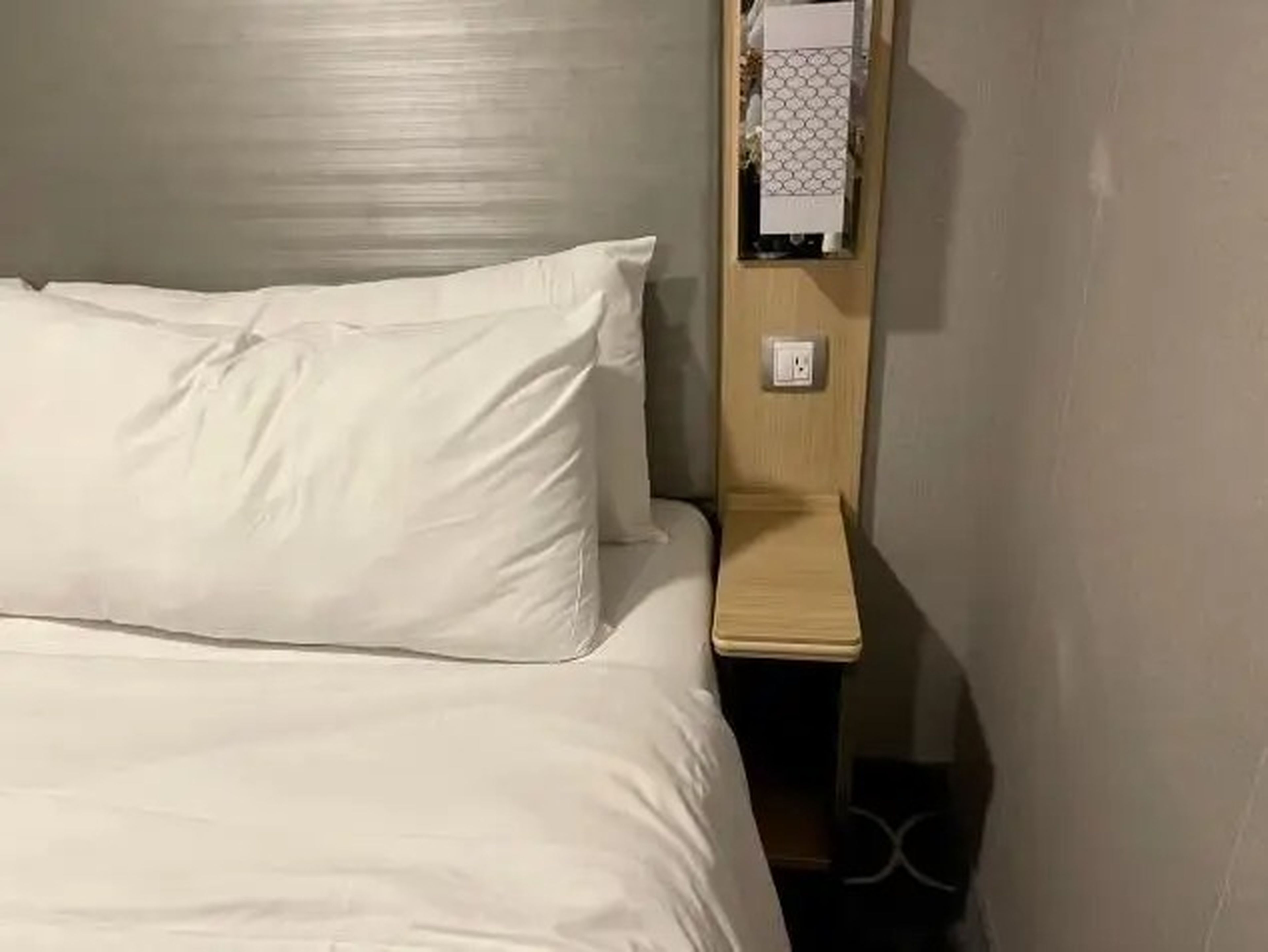 side of the bed in interior cabin, plug on the right symphony of the seas