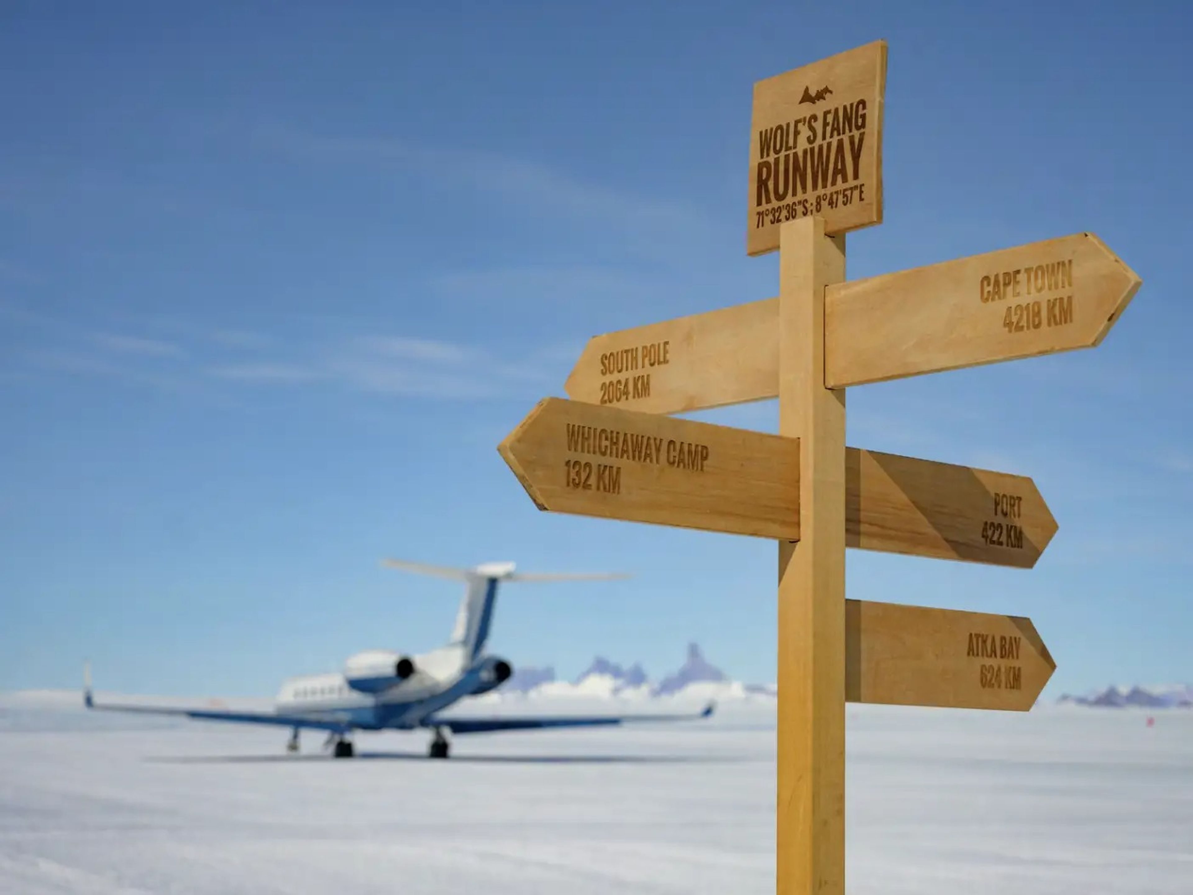 Signage in Antarctica for White Desert's camps with the G550 in the background.