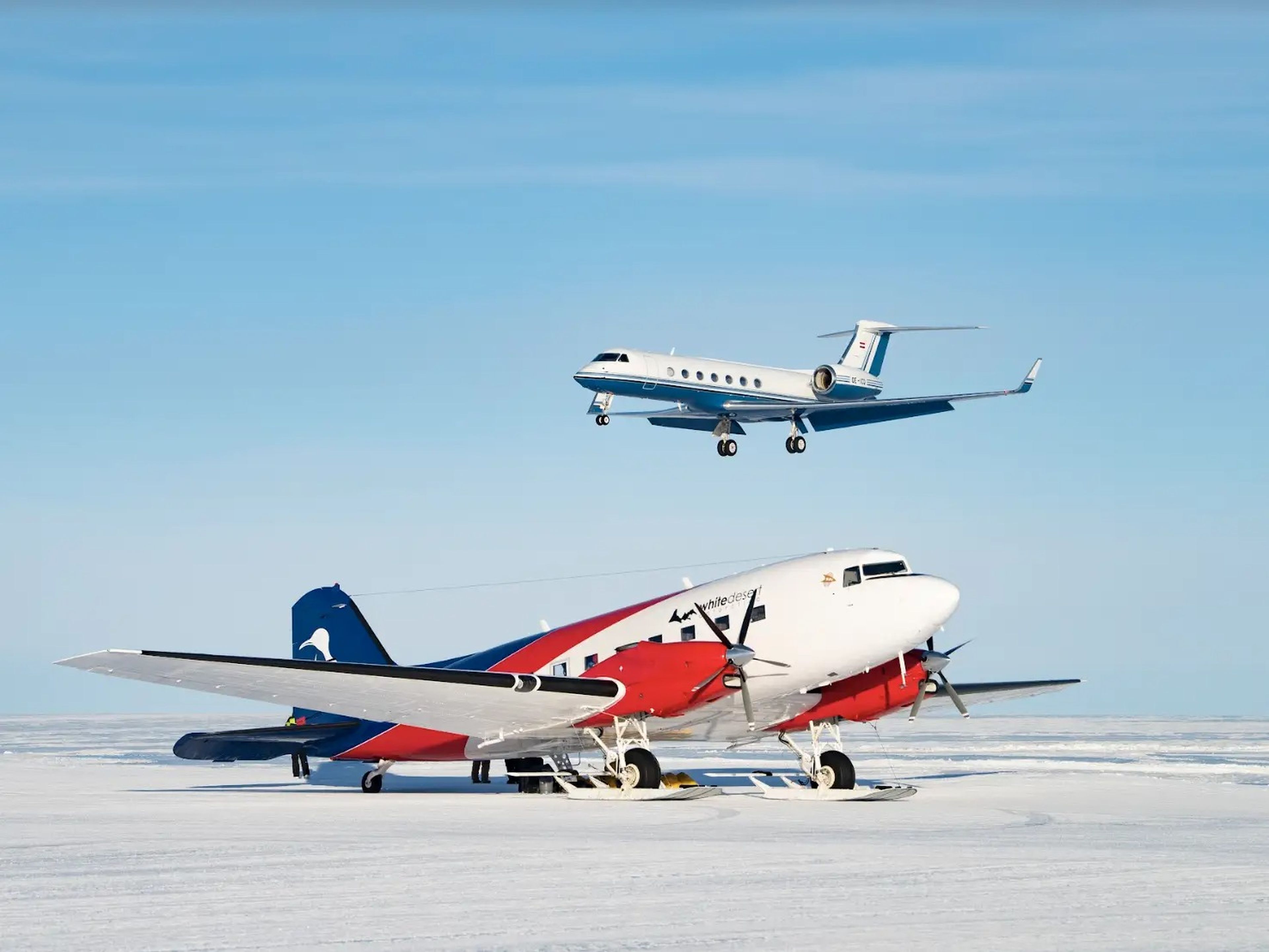A ski plane on Wolf's Fang Runway while the G550 is landing behind.