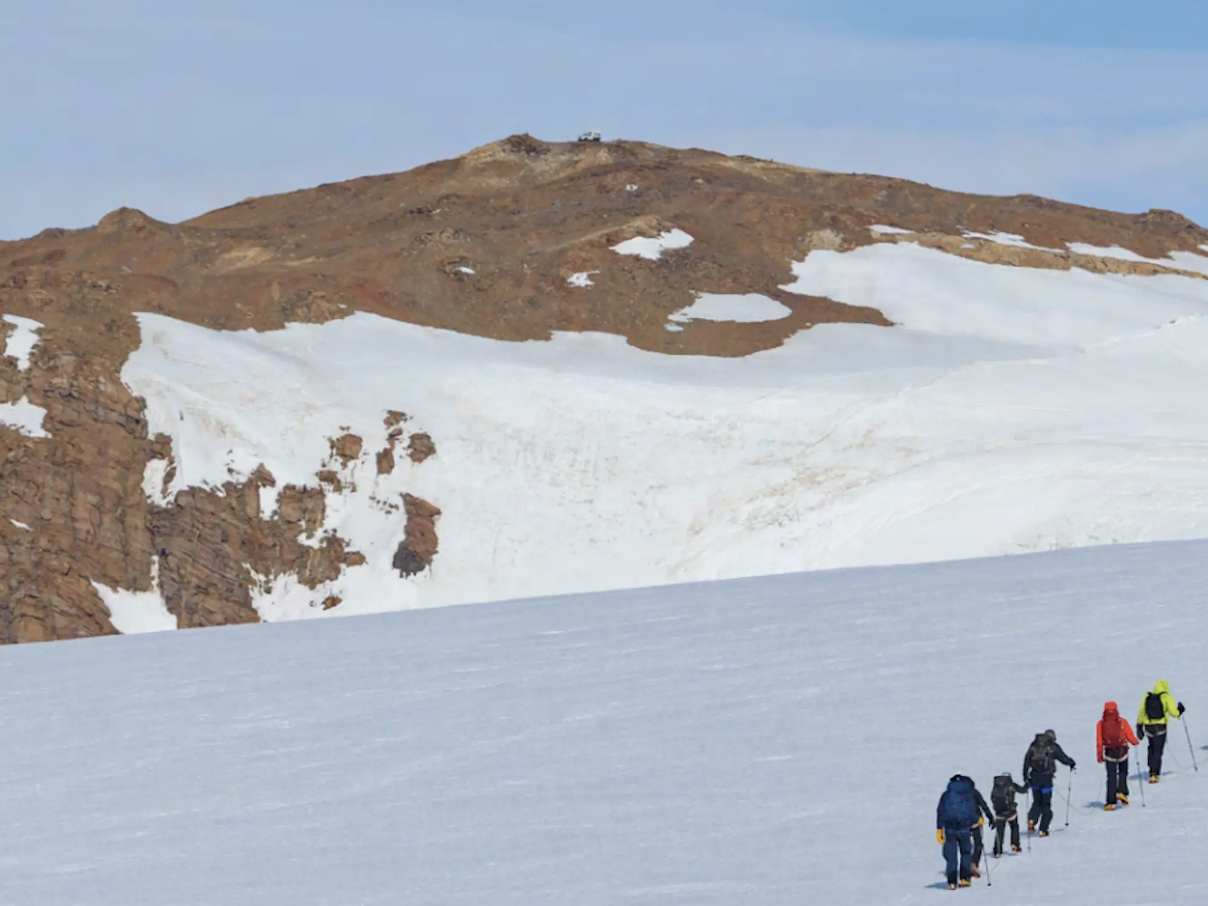 Tourists walking on Antarctica during White Desert's tour.