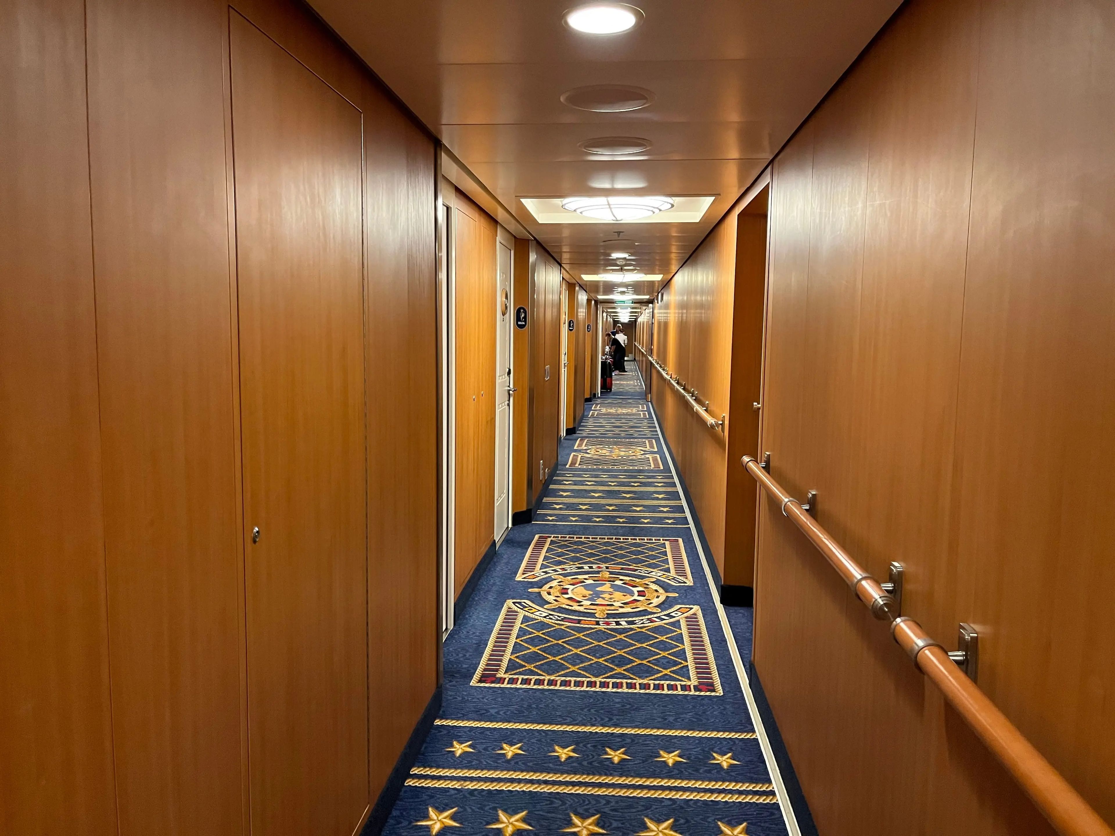 wooden and carpeted hallway on the disney fantasy cruise ship