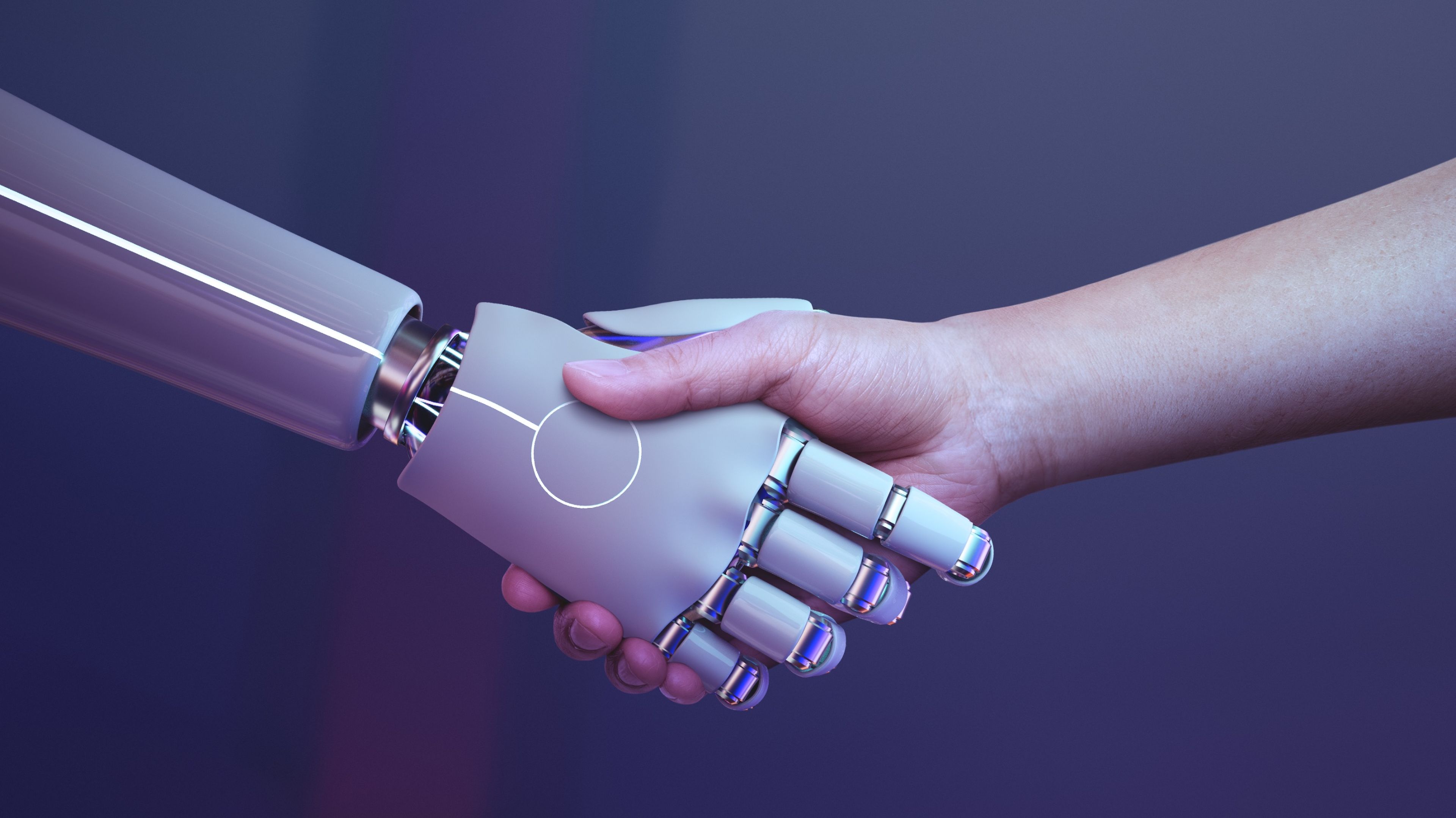 Apretón de manos entre un robot y una persona