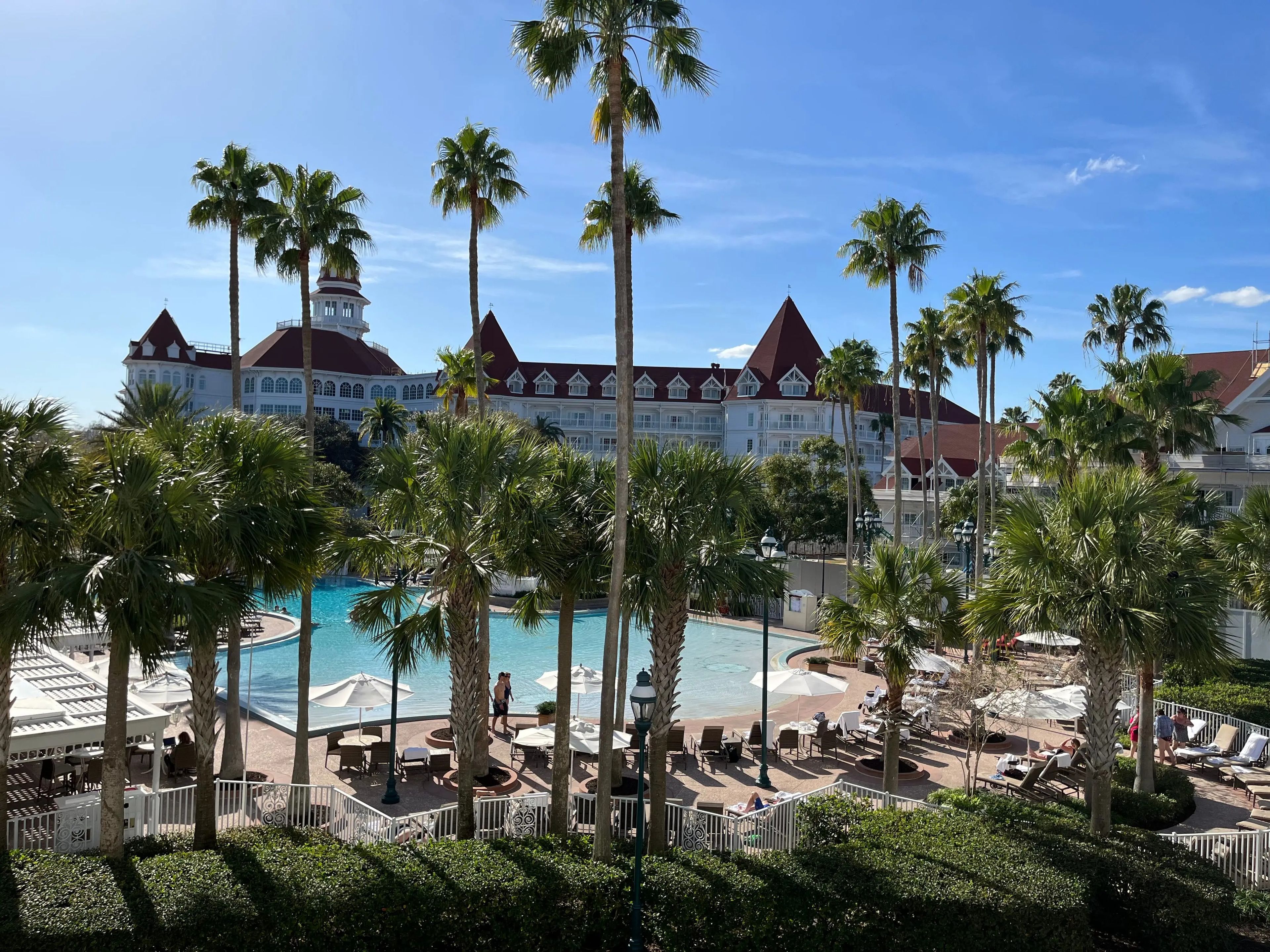 view of the grand floridian resort and pool from the patio of jenna's hotel room