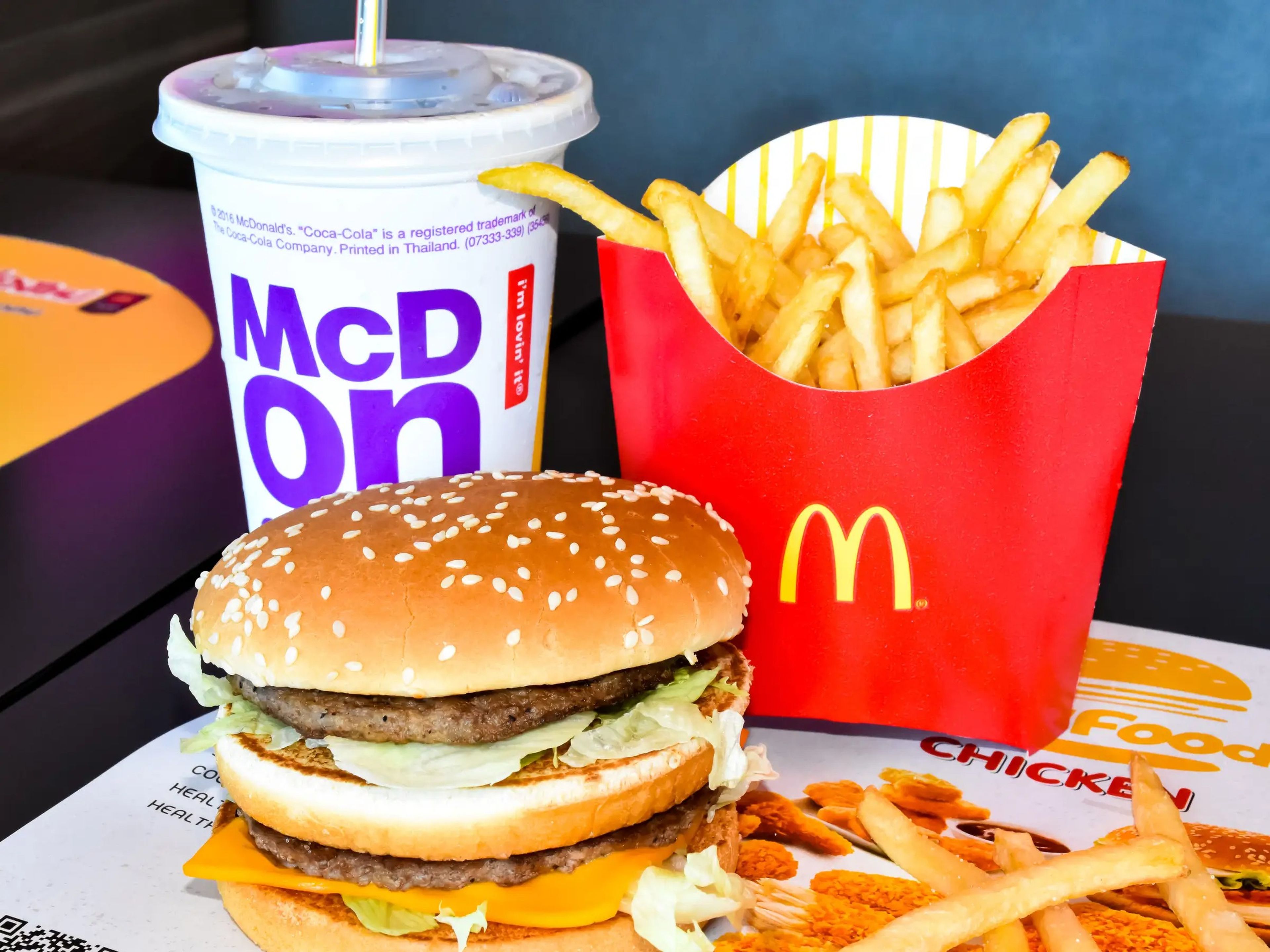mcdonald's hamburger, fries, and drink on a tray